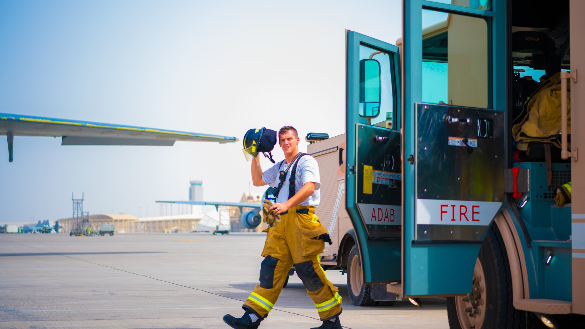 U.S. Air Force Airmen of the 380th Expeditionary Fire Department perform an exercise involving a KC-10 Extender aircraft at Al Dhafra Air Base, United Arab Emirates.