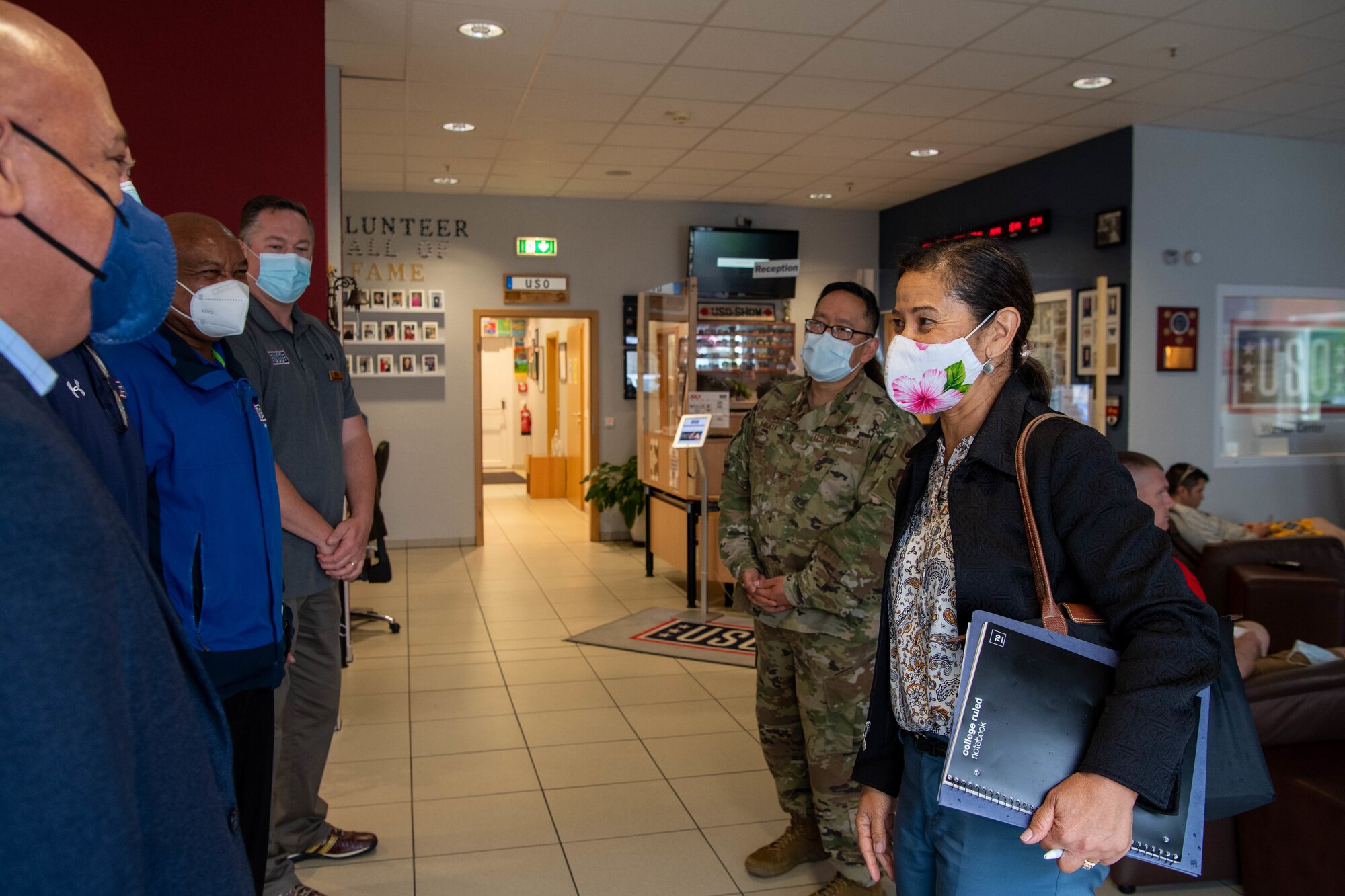 Mrs. Sharene Brown, spouse of Air Force Chief of Staff Gen. CQ Brown, Jr, is greeted by staff members of the United Service Organizations Warrior Center