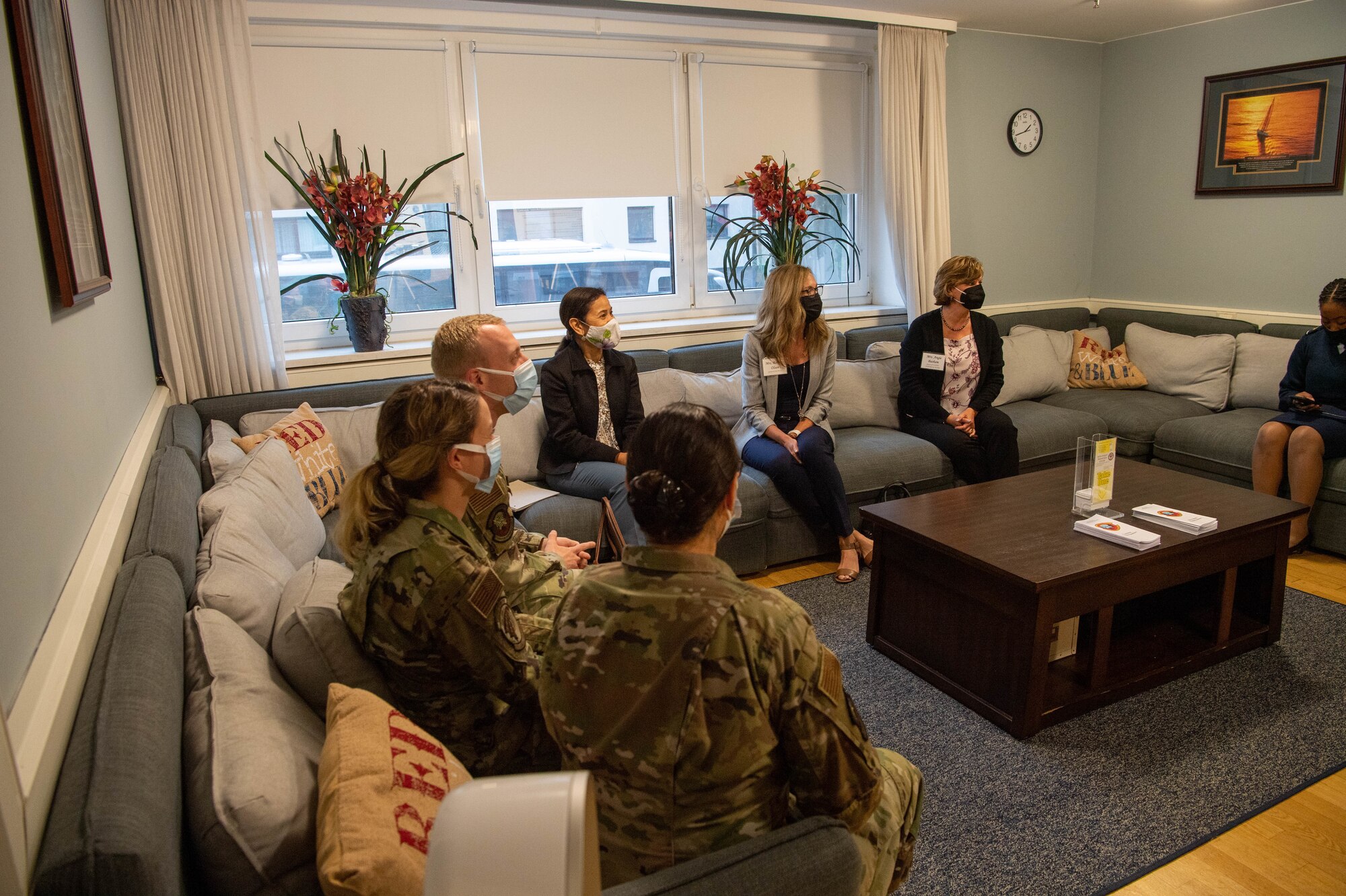 Mrs. Sharene Brown, spouse of Air Force Chief of Staff Gen. CQ Brown, Jr, listens to staff briefers from the Deployment Training Center at Ramstein Air Base