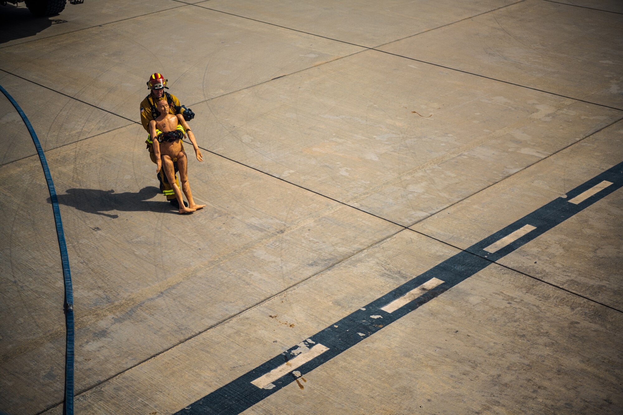U.S. Air Force Airmen of the 380th Expeditionary Fire Department perform an exercise involving a KC-10 Extender aircraft at Al Dhafra Air Base, United Arab Emirates.