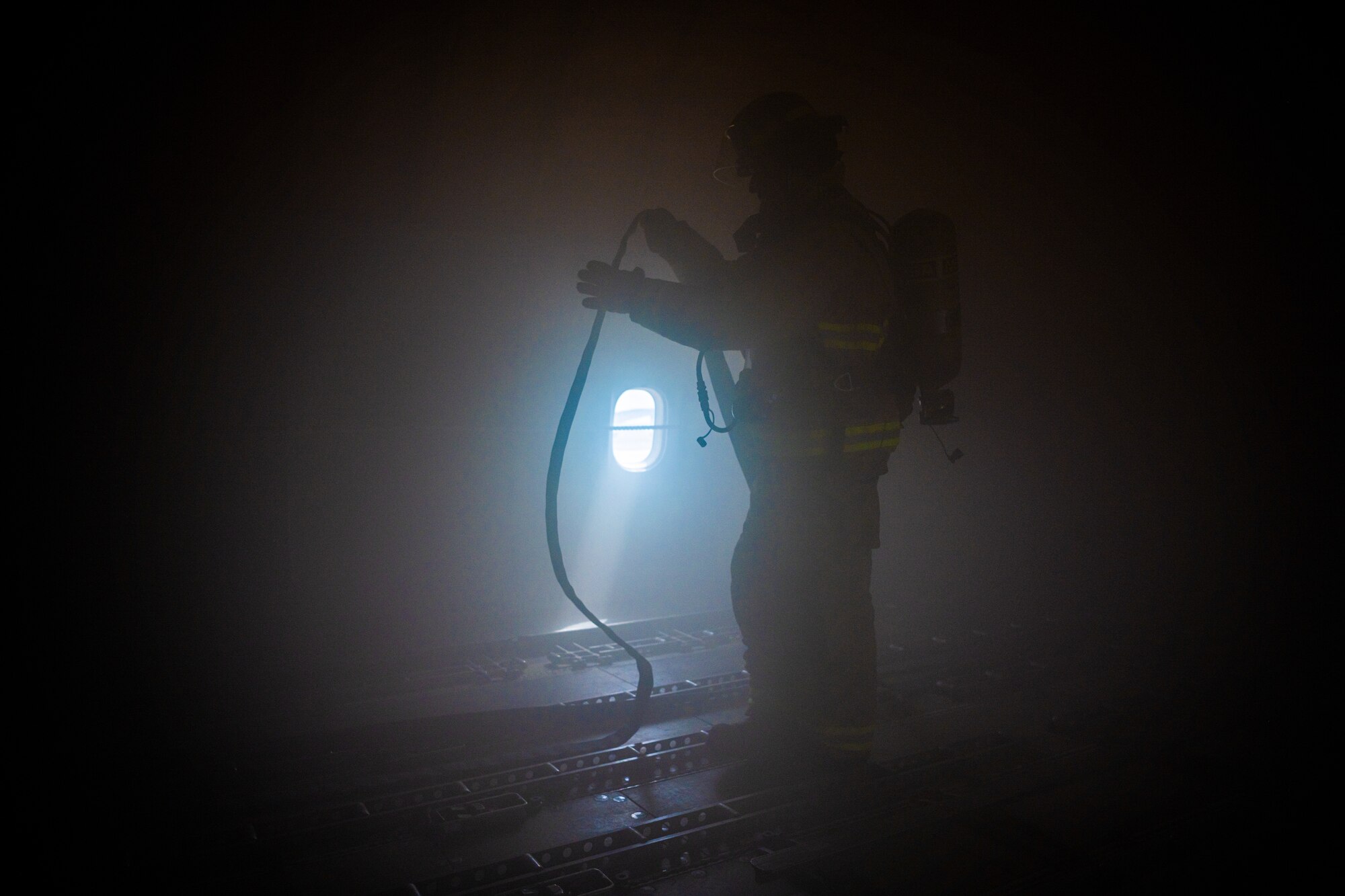 U.S. Air Force Airmen of the 380th Expeditionary Fire Department perform an exercise involving a KC-10 Extender aircraft at Al Dhafra Air Base, United Arab Emirates.