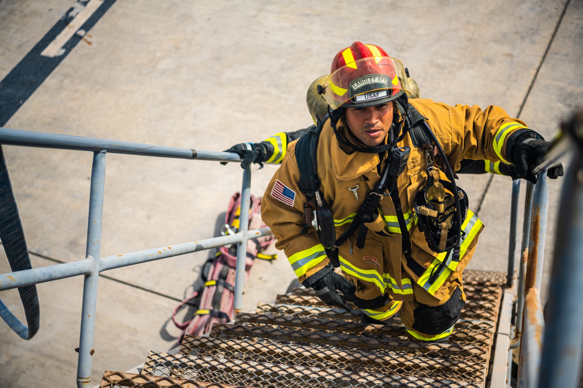 U.S. Air Force Airmen of the 380th Expeditionary Fire Department perform an exercise involving a KC-10 Extender aircraft at Al Dhafra Air Base, United Arab Emirates.