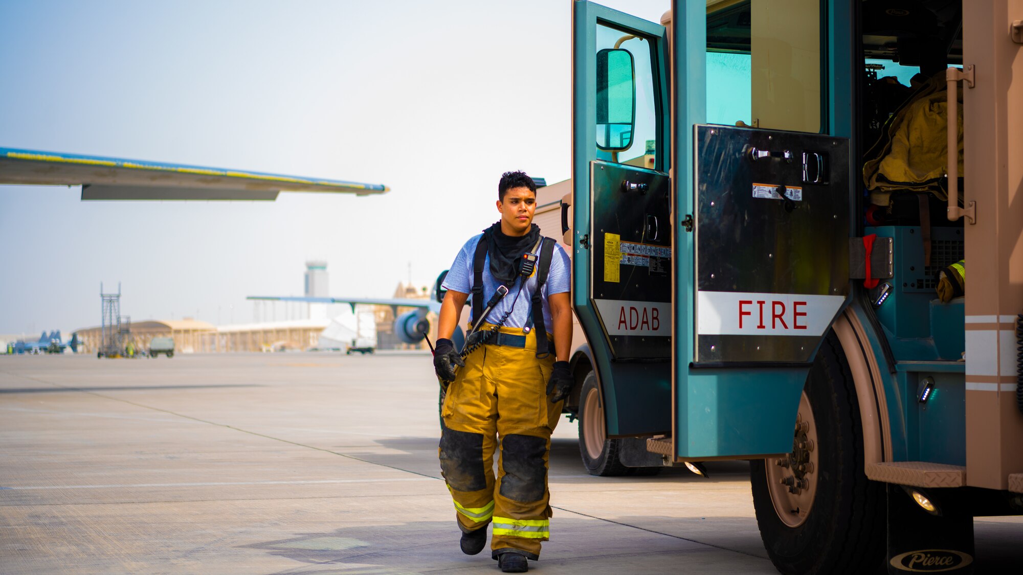 U.S. Air Force Airmen of the 380th Expeditionary Fire Department perform an exercise involving a KC-10 Extender aircraft at Al Dhafra Air Base, United Arab Emirates.