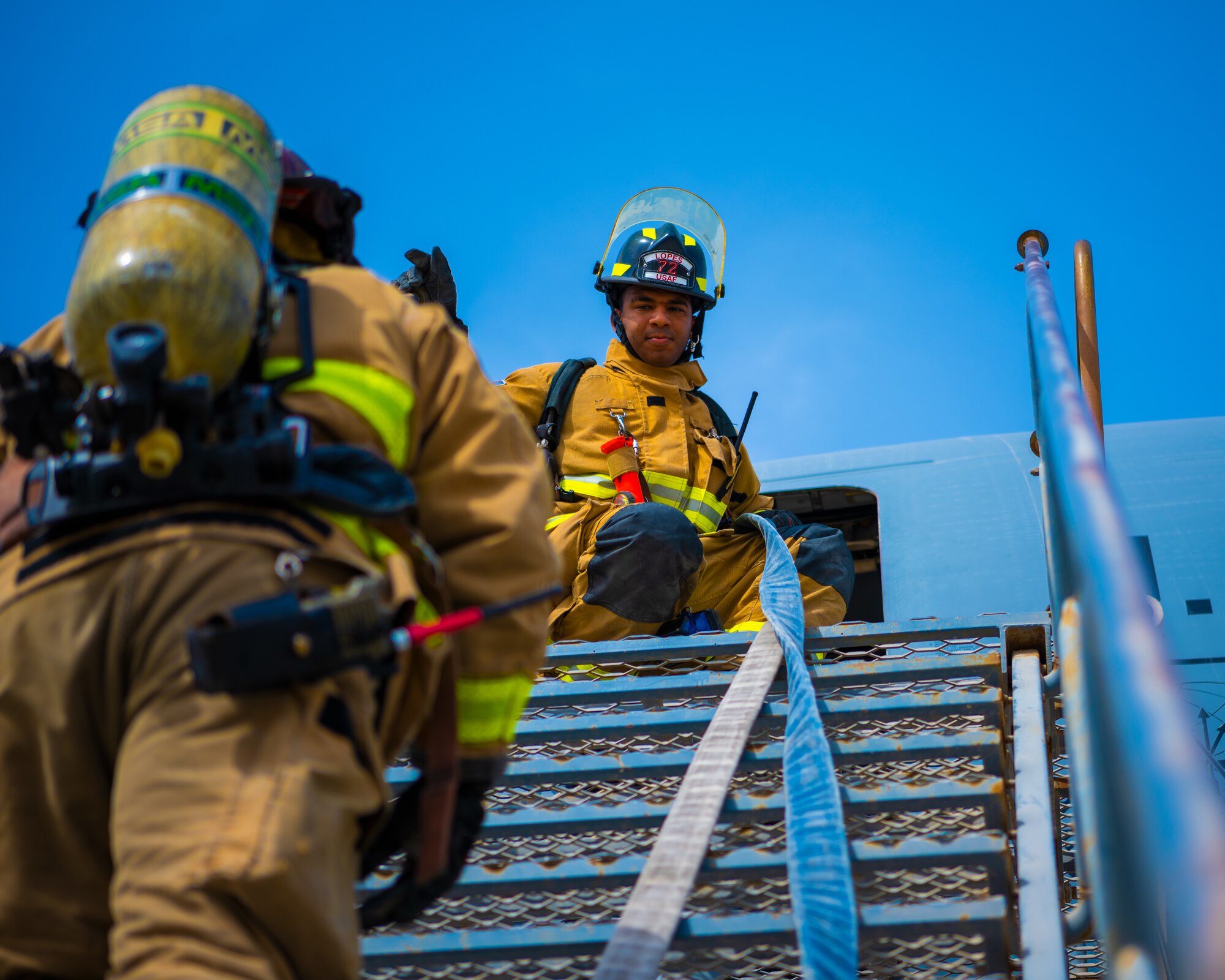 U.S. Air Force Airmen of the 380th Expeditionary Fire Department perform an exercise involving a KC-10 Extender aircraft at Al Dhafra Air Base, United Arab Emirates.