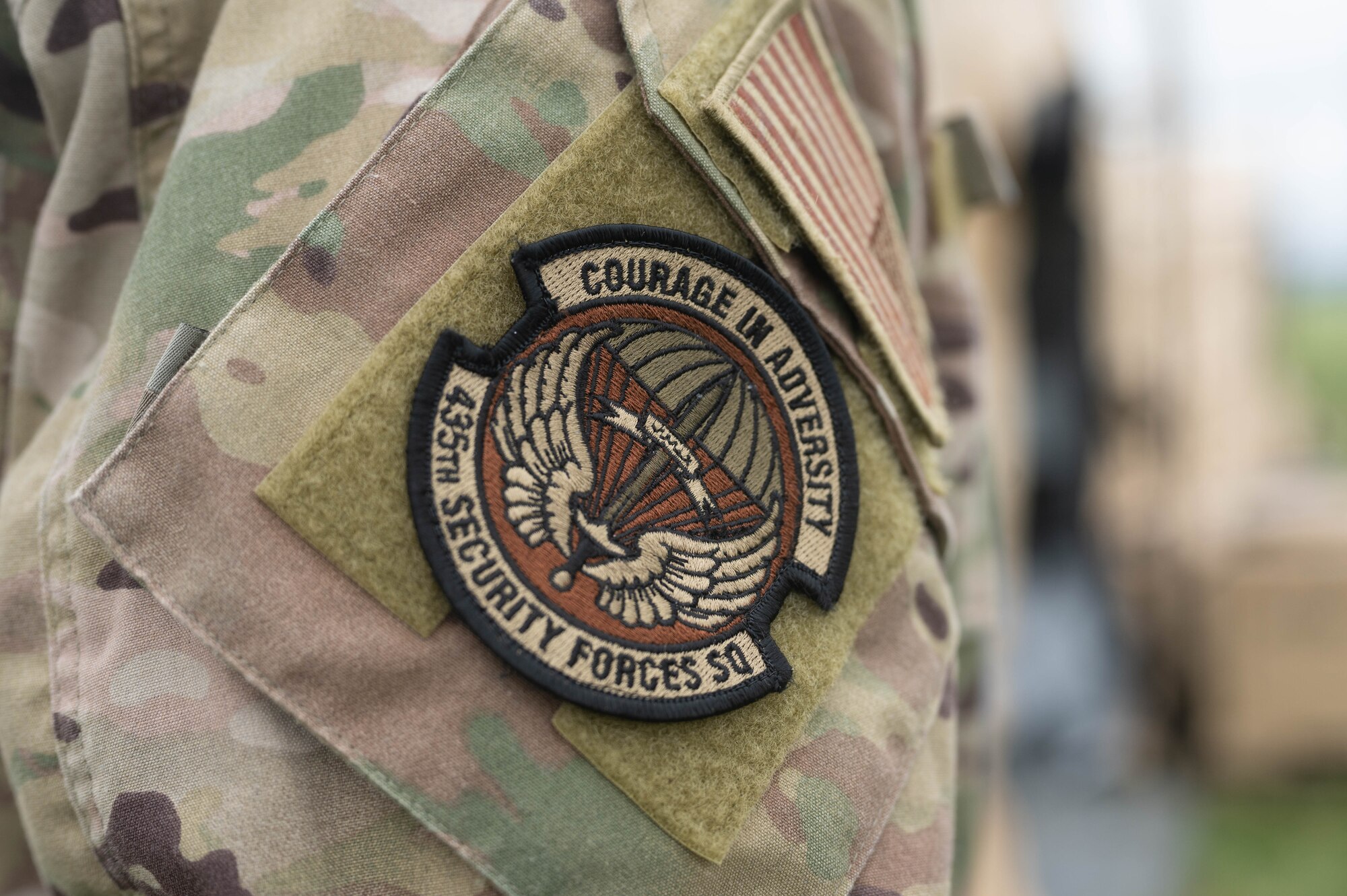 Airman displays his patch.