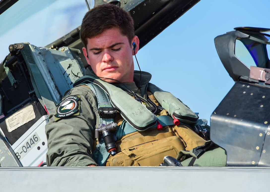 A U.S. Air Force F-16 Fighting Falcon pilot assigned to the 555th Fighter Squadron sits in the cockpit of a U.S. Air Force F-16 during  Thracian Star 21 at Graf Ignatievo Air Base, Bulgaria, July 12, 2021. Thracian Star 21 enhances professional relationships and improves overall coordination with allies and partner militaries. (U.S. Air Force photo by Airman 1st Class Brooke Moeder)