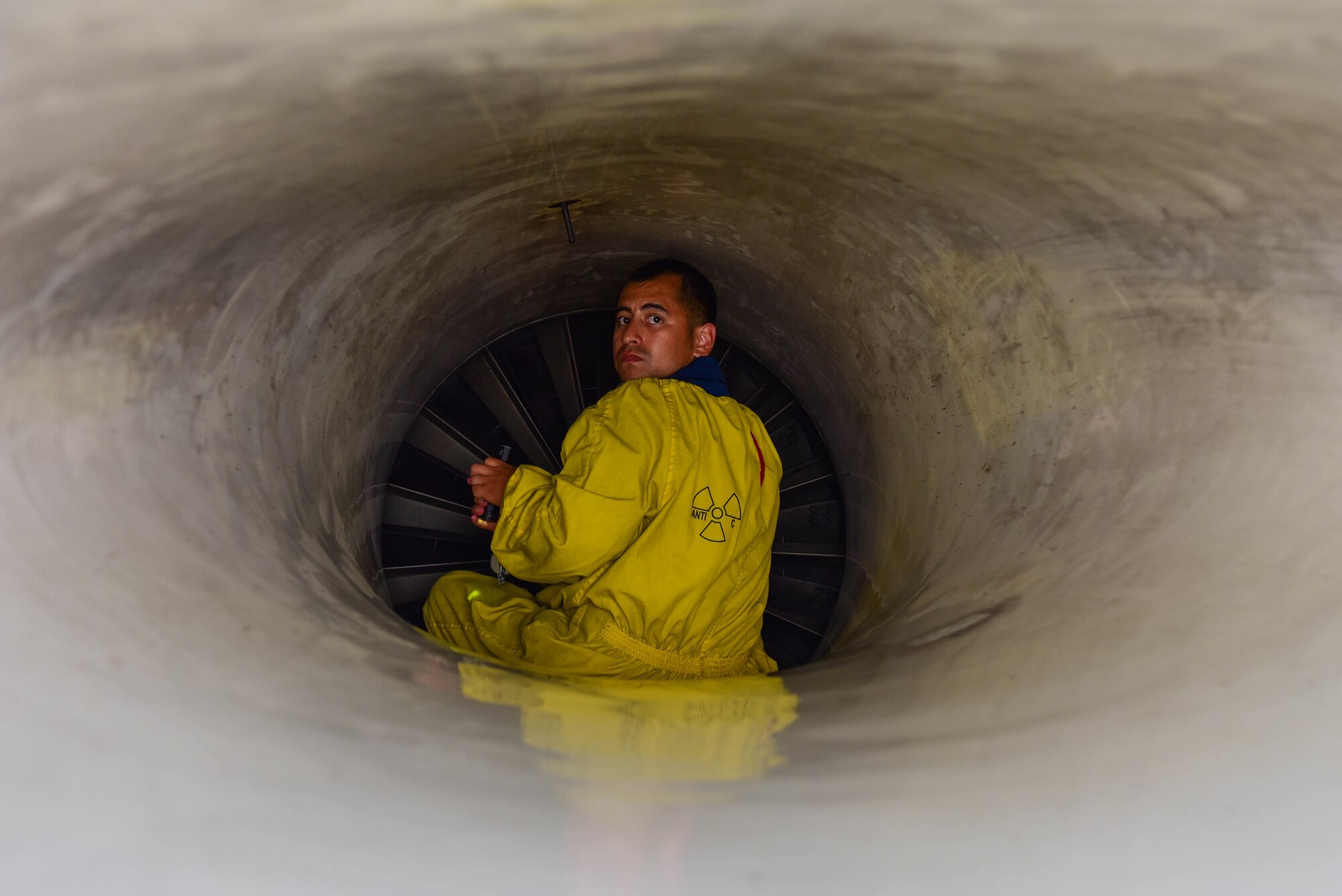 A U.S. Air Force F-16 Fighting Falcon crew chief assigned to the 555th Aircraft Maintenance Unit performs a pre-flight inspection on a U.S. Air Force F-16 intake at Graf Ignatievo Air Base, Bulgaria, July 13, 2021. Eight F-16s assigned to the 555th Fighter Squadron are participating in Thracian Star 21, a Bulgarian air force-led exercise aiming to maximize interoperability, combat effectiveness and survival awareness. (U.S. Air Force photo by Airman 1st Class Brooke Moeder)