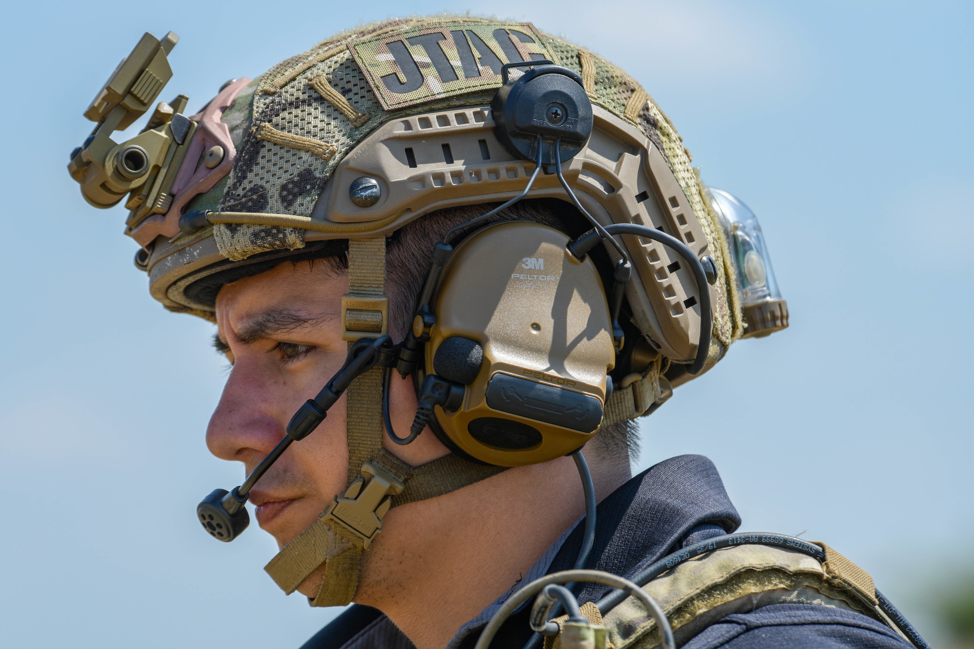 A joint terminal attack controller (JTAC) assigned to Detachment 1, 4th Combat Training Squadron, Ramstein Air Base, Germany, directs the action of U.S. Air Force F-16 Fighting Falcon aircraft assigned to the 555th Fighter Squadron at the Graf Ignatievo range, Bulgaria, July 14, 2021. A JTAC is a qualified service member who directs the action of combat aircraft engaged in close air support and other offensive air operations from a forward position. (U.S. Air Force photo by Airman 1st Class Brooke Moeder)