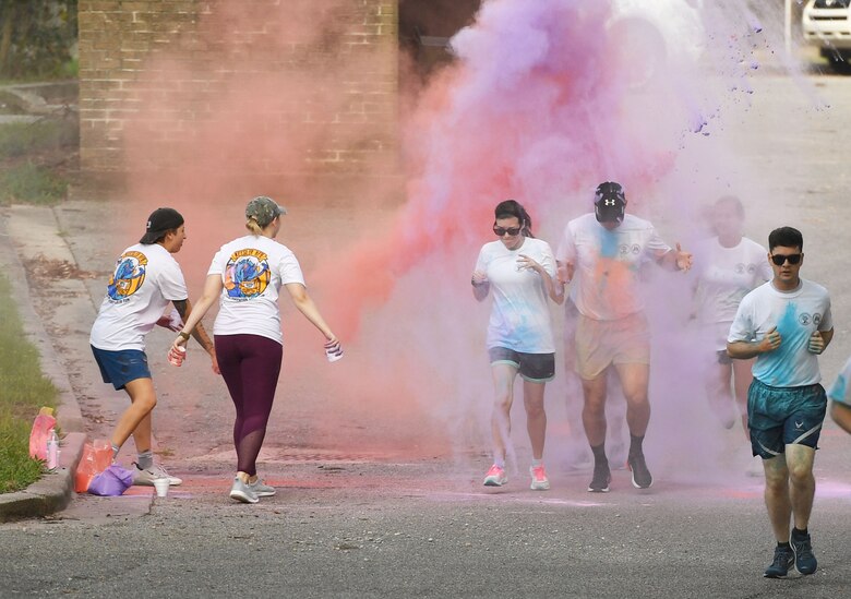 Keesler personnel participates in a 5K Color Run at Keesler Air Force Base, Mississippi, July 15, 2021. Keesler personnel participates in the 5K Color Run at Keesler Air Force Base, Mississippi, July 15, 2021. The run, hosted by the Keesler Airman’s Council, Air Force Sergeants Association and the Wing 5/6, was held in recognition of suicide awareness. (U.S. Air Force photo by Kemberly Groue)