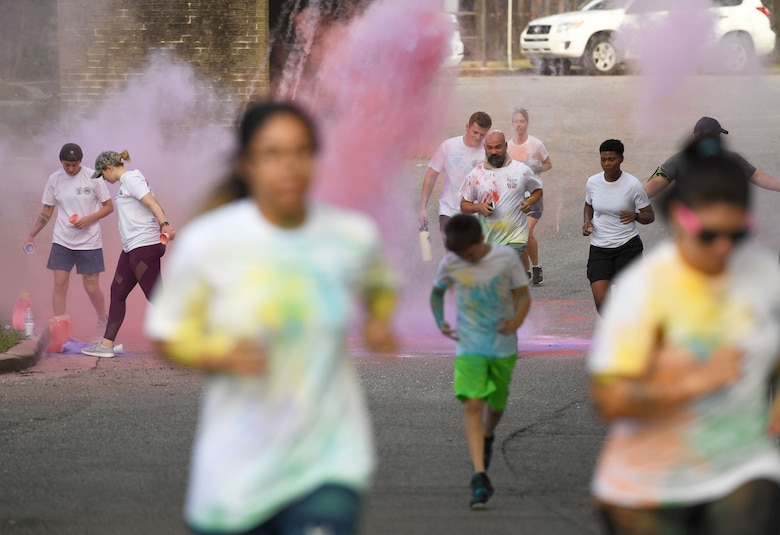 Keesler personnel participates in a 5K Color Run at Keesler Air Force Base, Mississippi, July 15, 2021. The run, hosted by the Keesler Airman’s Council, Air Force Sergeants Association and the Wing 5/6, was held in recognition of suicide awareness. (U.S. Air Force photo by Kemberly Groue)