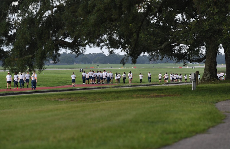 Keesler personnel participates in a 5K Color Run at Keesler Air Force Base, Mississippi, July 15, 2021. Keesler personnel participates in the 5K Color Run at Keesler Air Force Base, Mississippi, July 15, 2021. The run, hosted by the Keesler Airman’s Council, Air Force Sergeants Association and the Wing 5/6, was held in recognition of suicide awareness. (U.S. Air Force photo by Kemberly Groue)