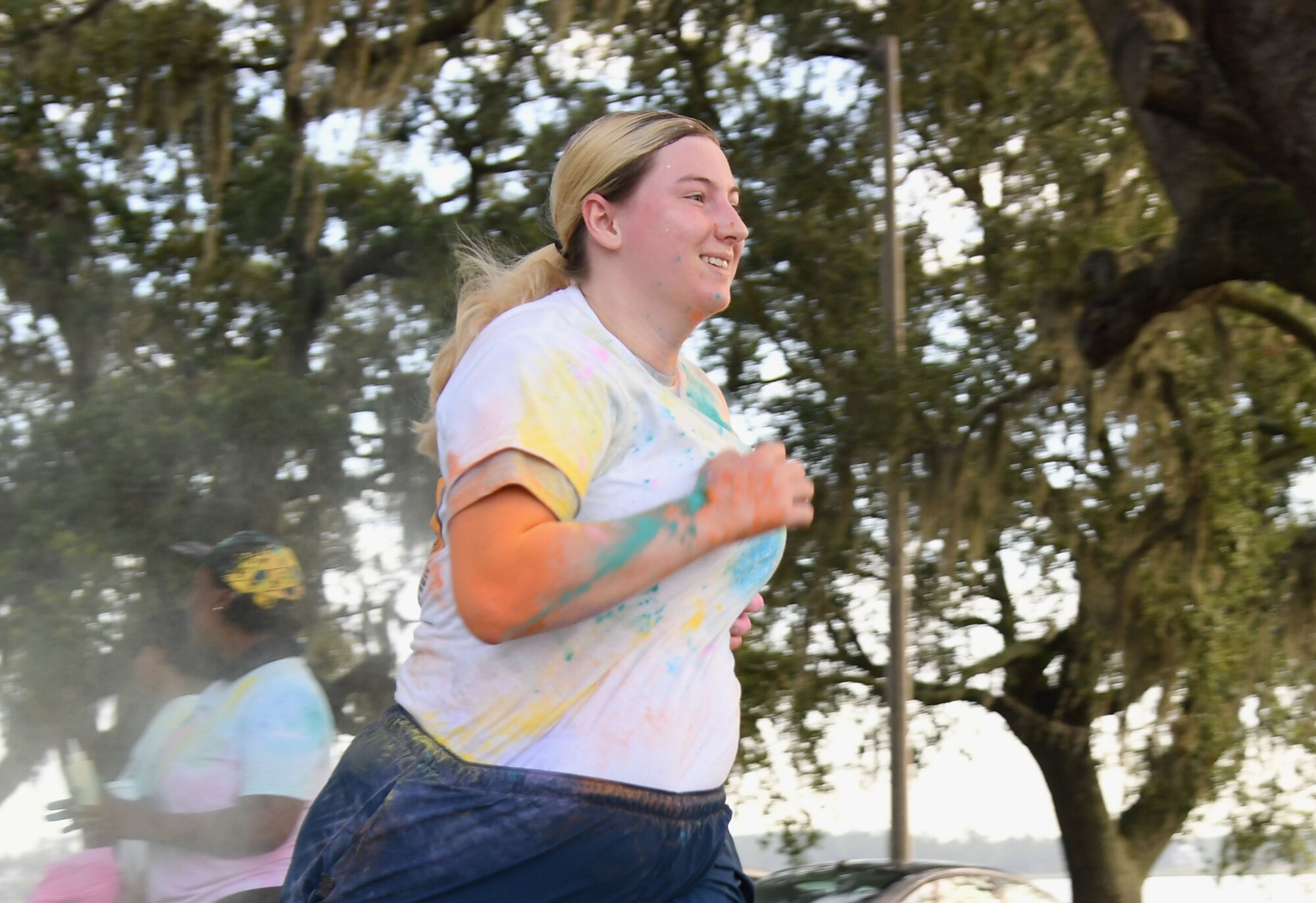 U.S. Air Force Senior Airman Kimberly Mueller, 81st Training Wing command information lead, participates in a 5K Color Run at Keesler Air Force Base, Mississippi, July 15, 2021. Keesler personnel participates in the 5K Color Run at Keesler Air Force Base, Mississippi, July 15, 2021. The run, hosted by the Keesler Airman’s Council, Air Force Sergeants Association and the Wing 5/6, was held in recognition of suicide awareness. (U.S. Air Force photo by Kemberly Groue)