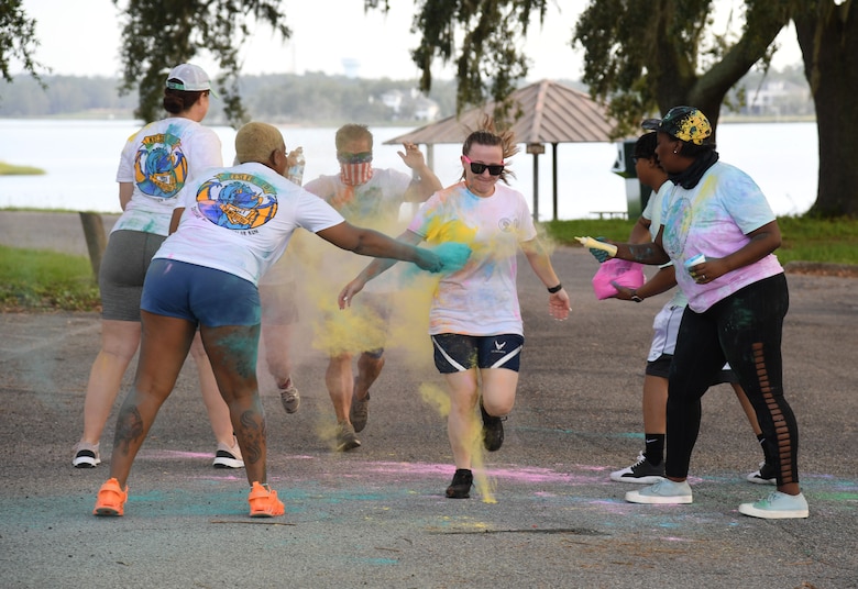Keesler personnel participates in a 5K Color Run at Keesler Air Force Base, Mississippi, July 15, 2021. Keesler personnel participates in the 5K Color Run at Keesler Air Force Base, Mississippi, July 15, 2021. The run, hosted by the Keesler Airman’s Council, Air Force Sergeants Association and the Wing 5/6, was held in recognition of suicide awareness. (U.S. Air Force photo by Kemberly Groue)
