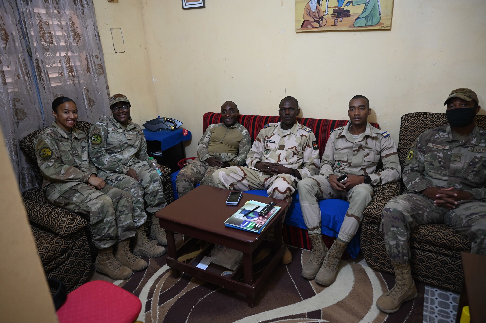 U.S. Air Force members assigned to Nigerien Air Base 201 pose for a photo with members from the Nigerien Armed Forces at Nigerien Air Base 201, Agadez, July 8, 2021.