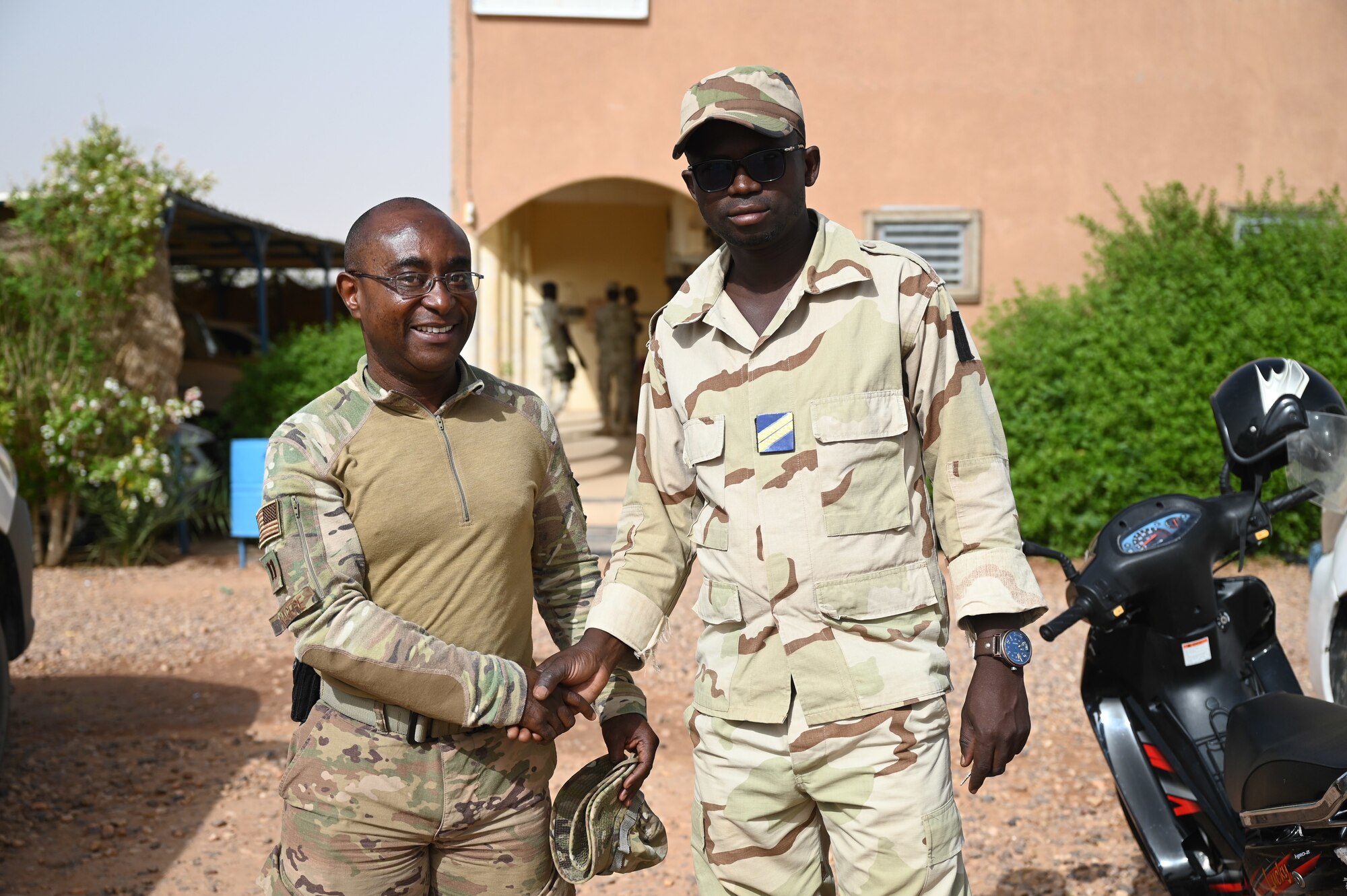 U.S. Air Force Capt. Guy Kagere, 435th Air Expeditionary Wing chaplain, poses for a photo with Nigerien Armed Forces Sergeant Souleman, FAN chaplain at Nigerien Air Base 201, Agadez, July 8, 2021.