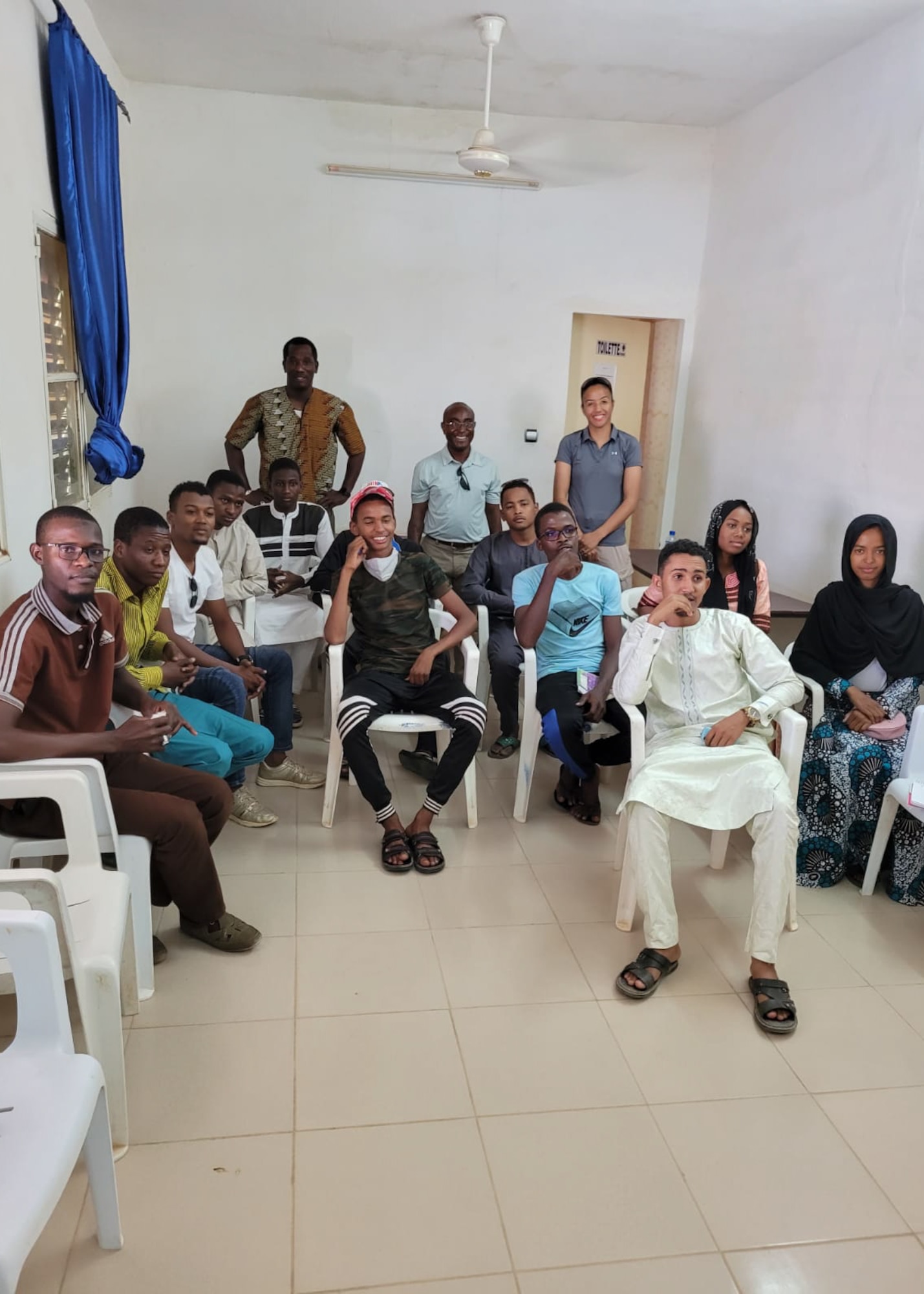 U.S. Air Force Capt. Guy Kagere, 435th Air Expeditionary Wing chaplain, poses for a photo with students from his English Club in Agadez City, Agadez, July 2, 2021.