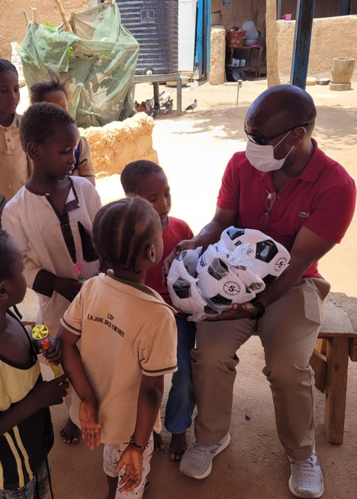 U.S. Air Force Capt. Guy Kagere, 435th Air Expeditionary Wing chaplain, donates supplies to children at an orphanage in Agadez City, Agadez, May 5, 2021.