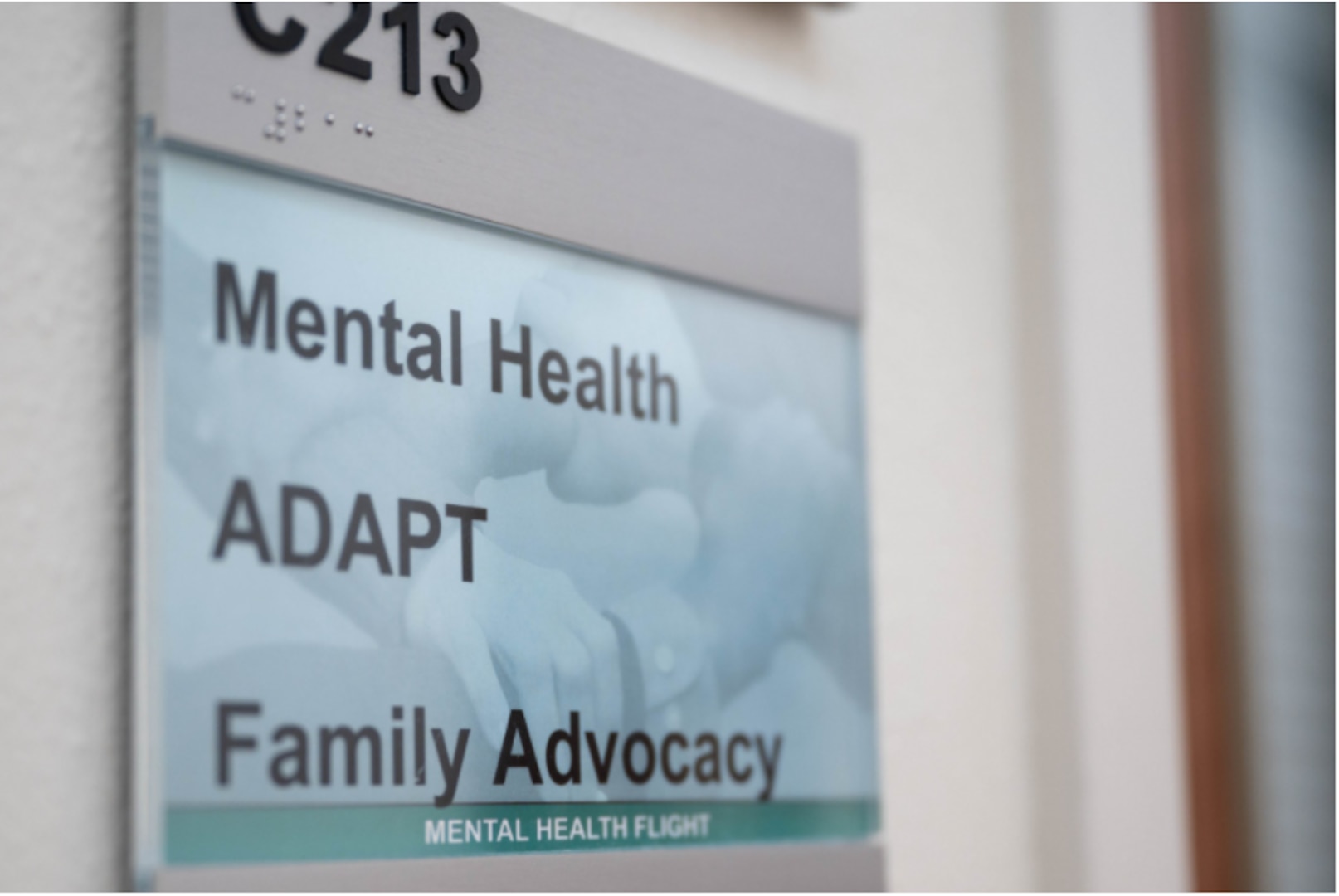 A room plaque for the 341st Operational Medical Readiness Squadron mental health flight is pictured inside the base clinic June 23, 2021, at Malmstrom Air Force Base Mont. The mental health flight offers mental health services to active duty members and manages the Family Advocacy and Alcohol and Drug Abuse Prevention and Treatment programs. (U.S. Air Force photo by Heather Heiney)