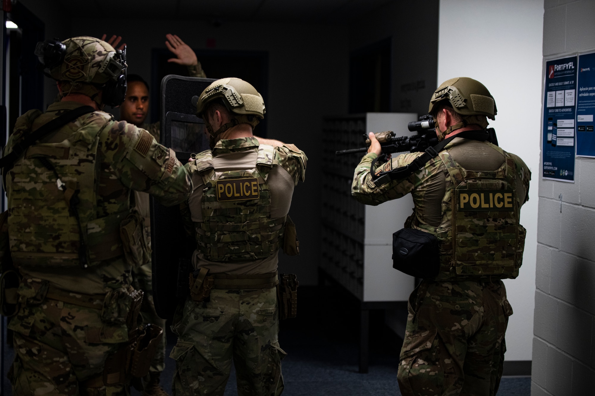 Members of the 325th Security Forces Squadron tactical response team move in to detain a simulated suspect during a training exercise in Panama City, Florida, July 13, 2021. The 325th SFS TRT trained to specialize in high-risk scenarios, including active shooters, barricaded suspects and hostage situations. (U.S. Air Force photo by Staff Sgt. Stefan Alvarez)