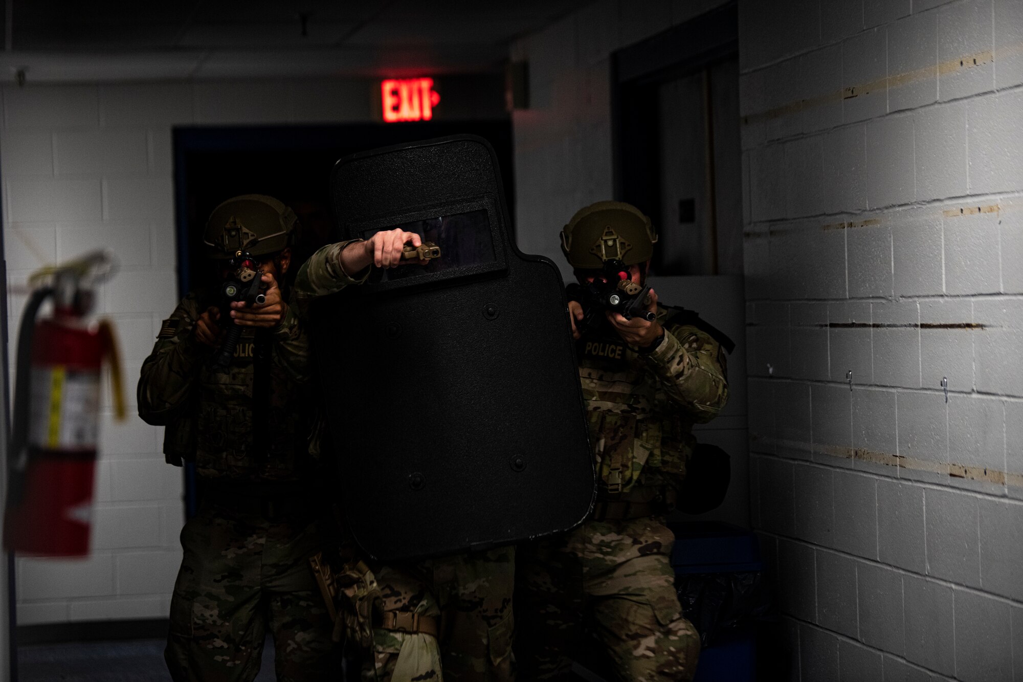 Members of the 325th Security Forces Squadron tactical response team move through a building during a training exercise in Panama City, Florida, July 13, 2021. The 325th SFS TRT trained to specialize in high-risk scenarios, including active shooters, barricaded suspects and hostage situations. (U.S. Air Force photo by Staff Sgt. Stefan Alvarez)