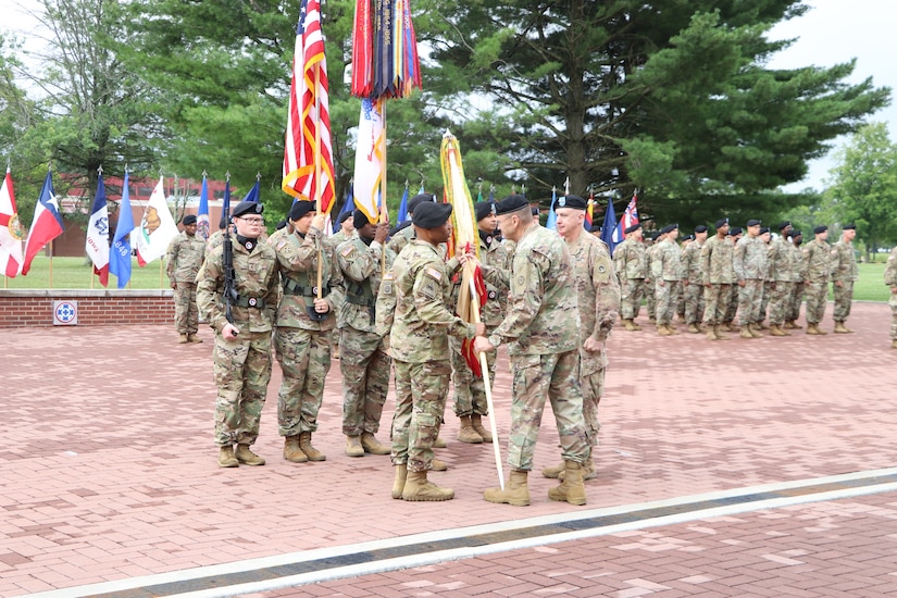 From left to right - Maj. Gen. John P. Sullivan, outgoing commanding general, 1st Theater Sustainment Command,  Lt. Gen. Terry R. Ferrell, commanding general, U.S. Army Central, and Maj. Gen. Michel M. Russell Sr., incoming commanding general, 1st TSC, look out at the formation during the 1st TSC change of command ceremony held July 13, 2021 outside of Fowler Hall at Fort Knox, Kentucky. Maj. Gen. Michel M. Russell Sr. assumed command of the 1st TSC from Maj. Gen. John P. Sullivan before an audience of current and former leaders, community members, family, and 1st TSC Soldiers. (U.S. Army Photo by Spc. Zoran Raduka)