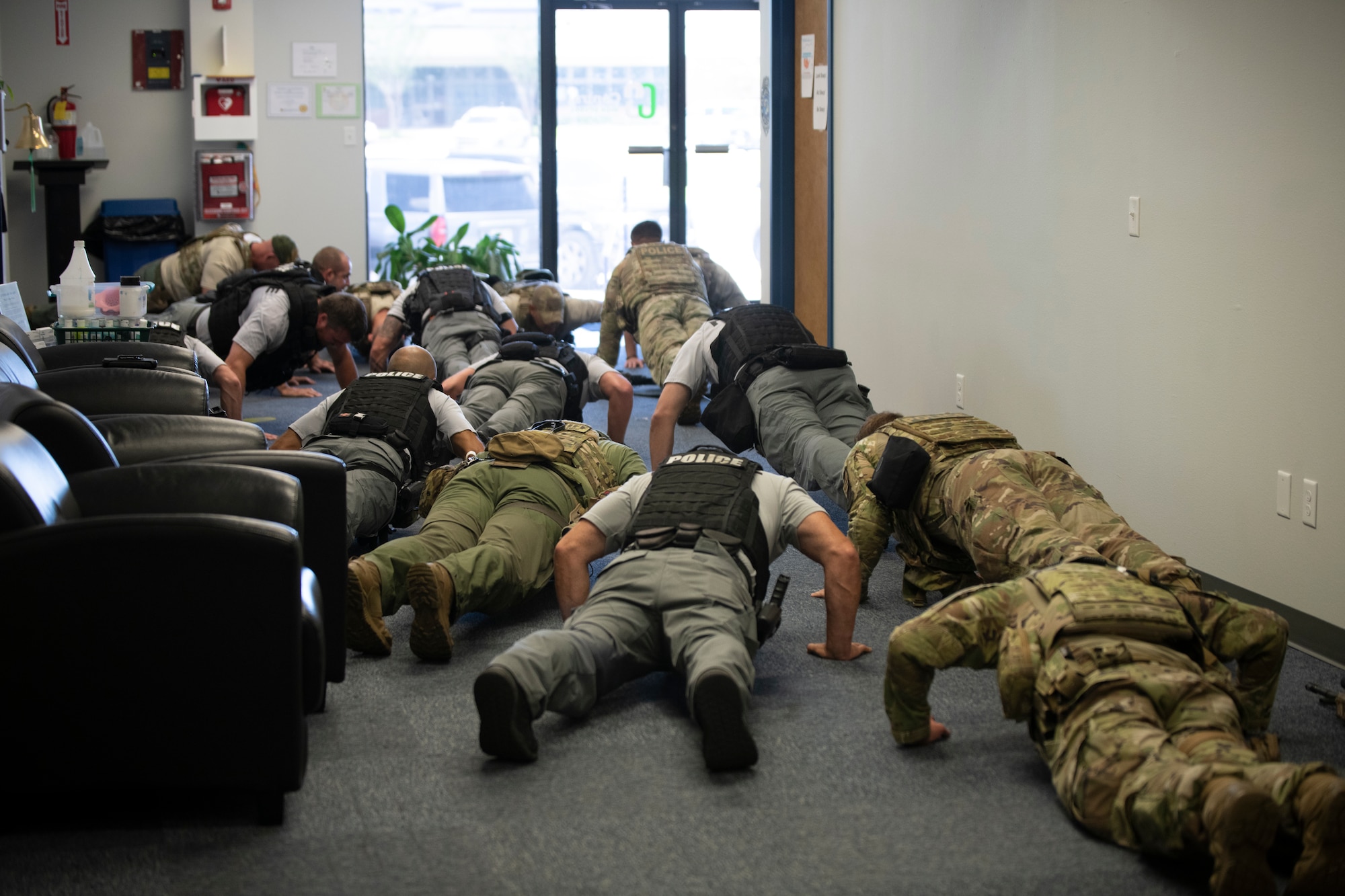 Members of the Bay County Sheriff’s Office and Panama City Police Department special weapons and tactics team perform push-ups with 325th Security Forces Squadron tactical response team members during a training exercise in Panama City, Florida, July 13, 2021. Various exercises were used as a team building tool to foster a “one team, one fight” mentality between the participating units. (U.S. Air Force photo by Staff Sgt. Stefan Alvarez)