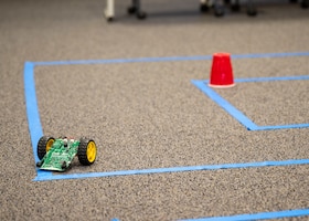 A small robot maneuvers through a maze during a Code Bot Course that was offered at Edwards Air Force Base, May 13. Project Code Bot graduated 10 remote students in May 2021 and is slated to conduct the next class August 16-20.