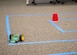 A small robot maneuvers through a maze during a Code Bot Course that was offered at Edwards Air Force Base, May 13. Project Code Bot graduated 10 remote students in May 2021 and is slated to conduct the next class August 16-20.