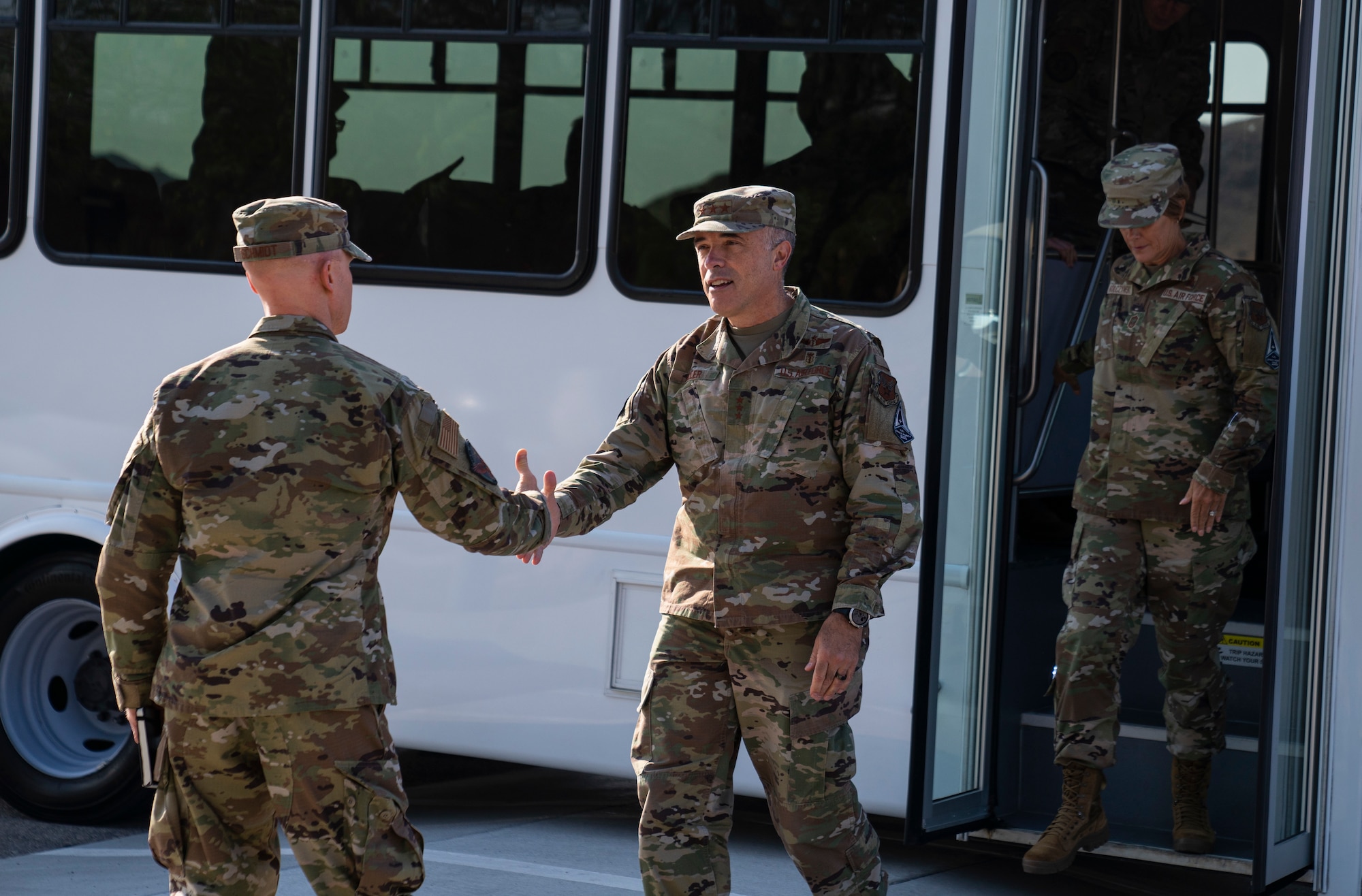 Col. Eric Schmidt, 432nd Wing/432nd Air Expeditionary Wing commander greets Lt. Gen. Robert Miller, Surgeon General of the Air Force and Space Force, at Creech Air Force Base.