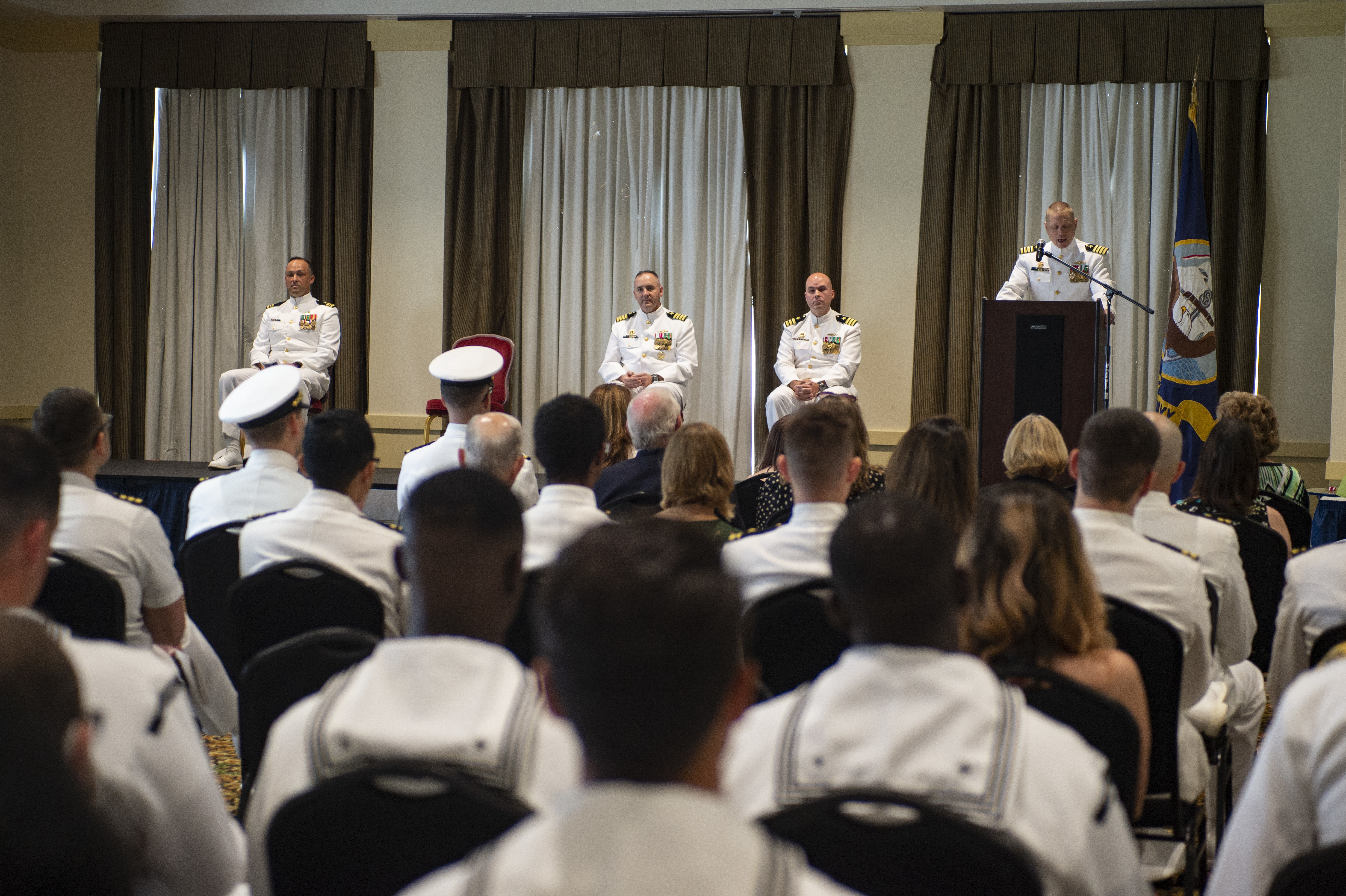 Cmdr. Jon Quimby, left, relieves Capt. Michael Delaney as commanding officer of the Virginia-class fast-attack submarine Pre-Commissioning Unit (PCU) Montana (SSN 794) during a change of command ceremony at Naval Station Norfolk, July 16, 2021.
