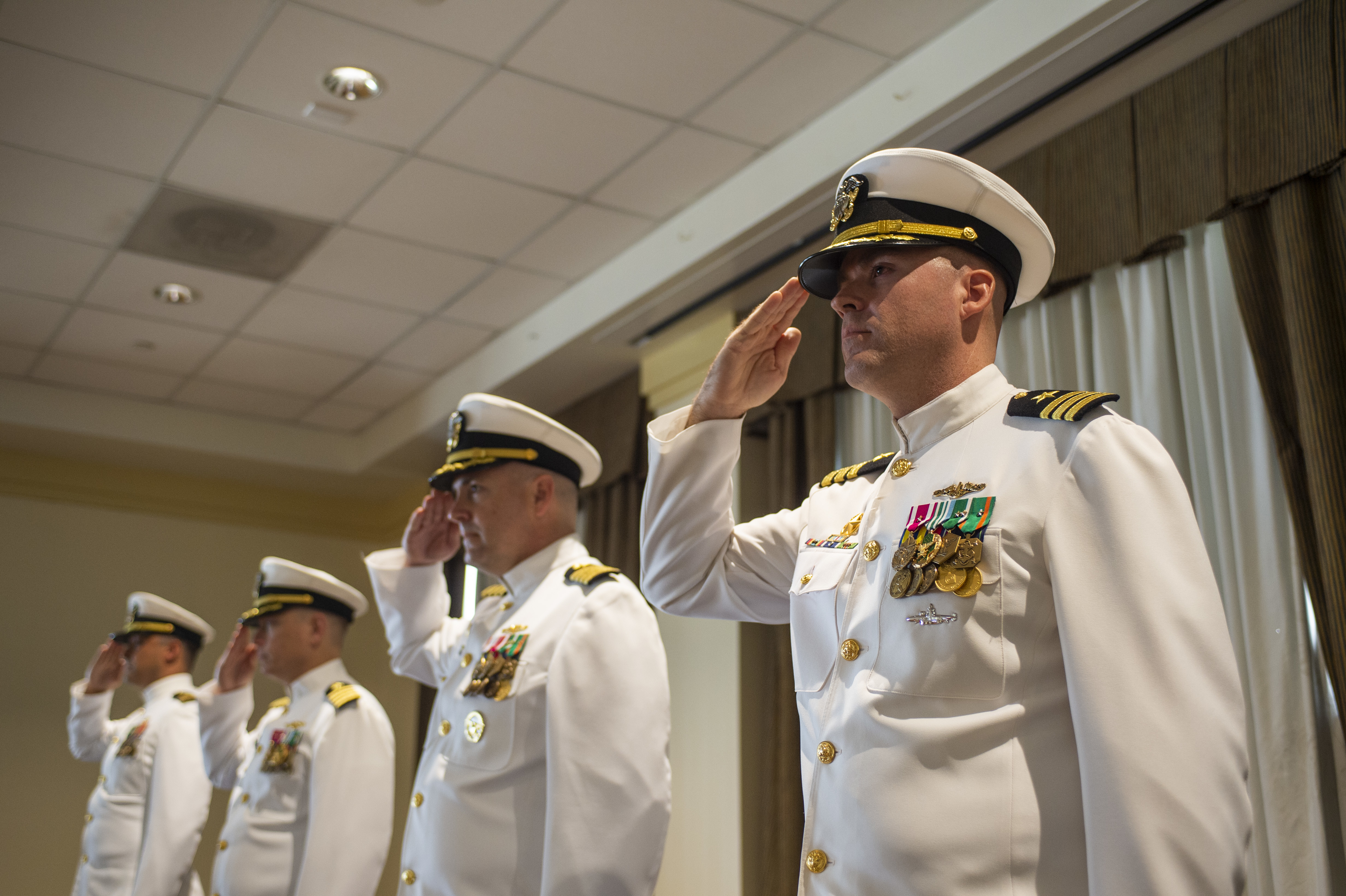 Cmdr. Jon Quimby, left, relieves Capt. Michael Delaney as commanding officer of the Virginia-class fast-attack submarine Pre-Commissioning Unit (PCU) Montana (SSN 794) during a change of command ceremony at Naval Station Norfolk, July 16, 2021.