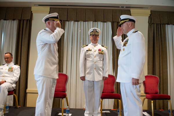 Cmdr. Jon Quimby, left, relieves Capt. Michael Delaney as commanding officer of the Virginia-class fast-attack submarine Pre-Commissioning Unit (PCU) Montana (SSN 794) during a change of command ceremony at Naval Station Norfolk, July 16, 2021.
