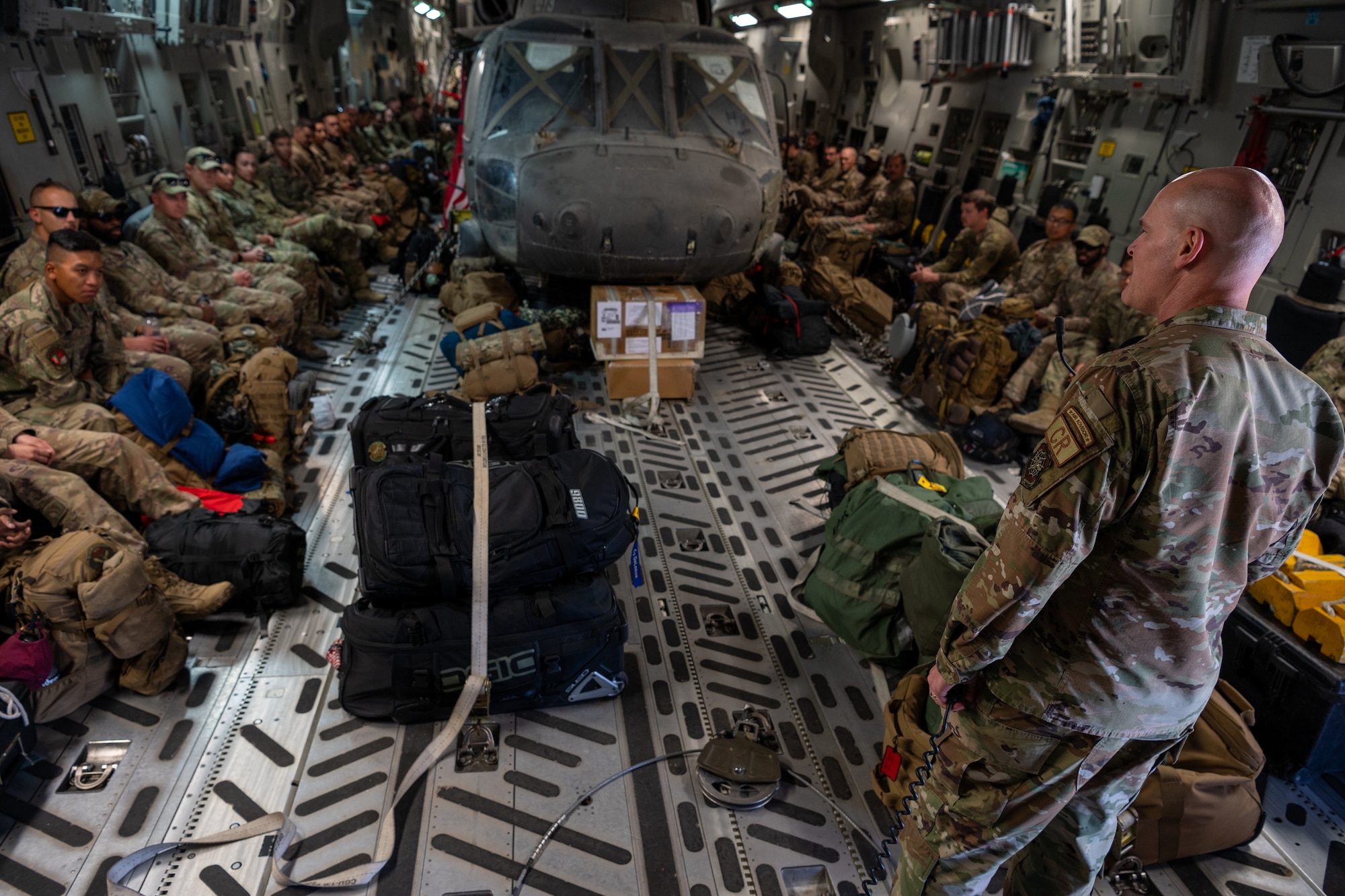 Col. Travis L. Edwards, 621st Contingency Response Wing commander, speaks to Airmen with the 821st Contingency Response Group upon their return from supporting retrograde operations in the Central Command area of responsibility June 19, 2021, at Joint Base McGuire-Dix-Lakehurst, New Jersey. The 821st CRG was part of Task Force 74 that assisted Resolute Support Mission Airmen with the safe and orderly withdrawal of U.S. personnel and cargo out of the AOR. (U.S. Air Force photo by Staff Sgt. Sarah Brice)