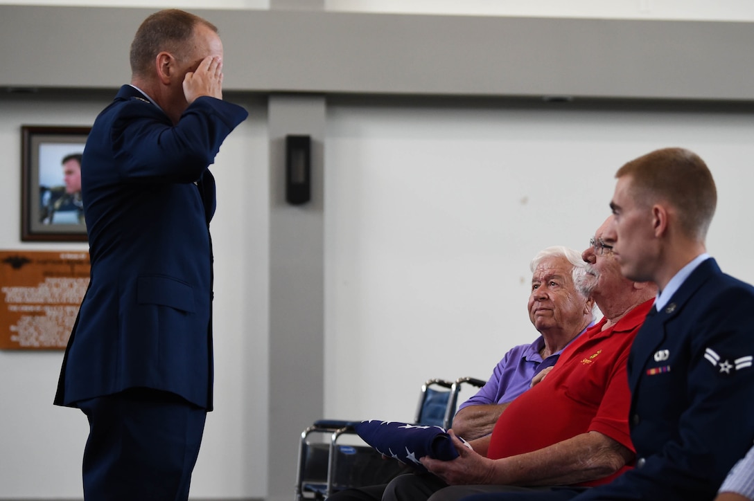 A photo of a commander saluting his father