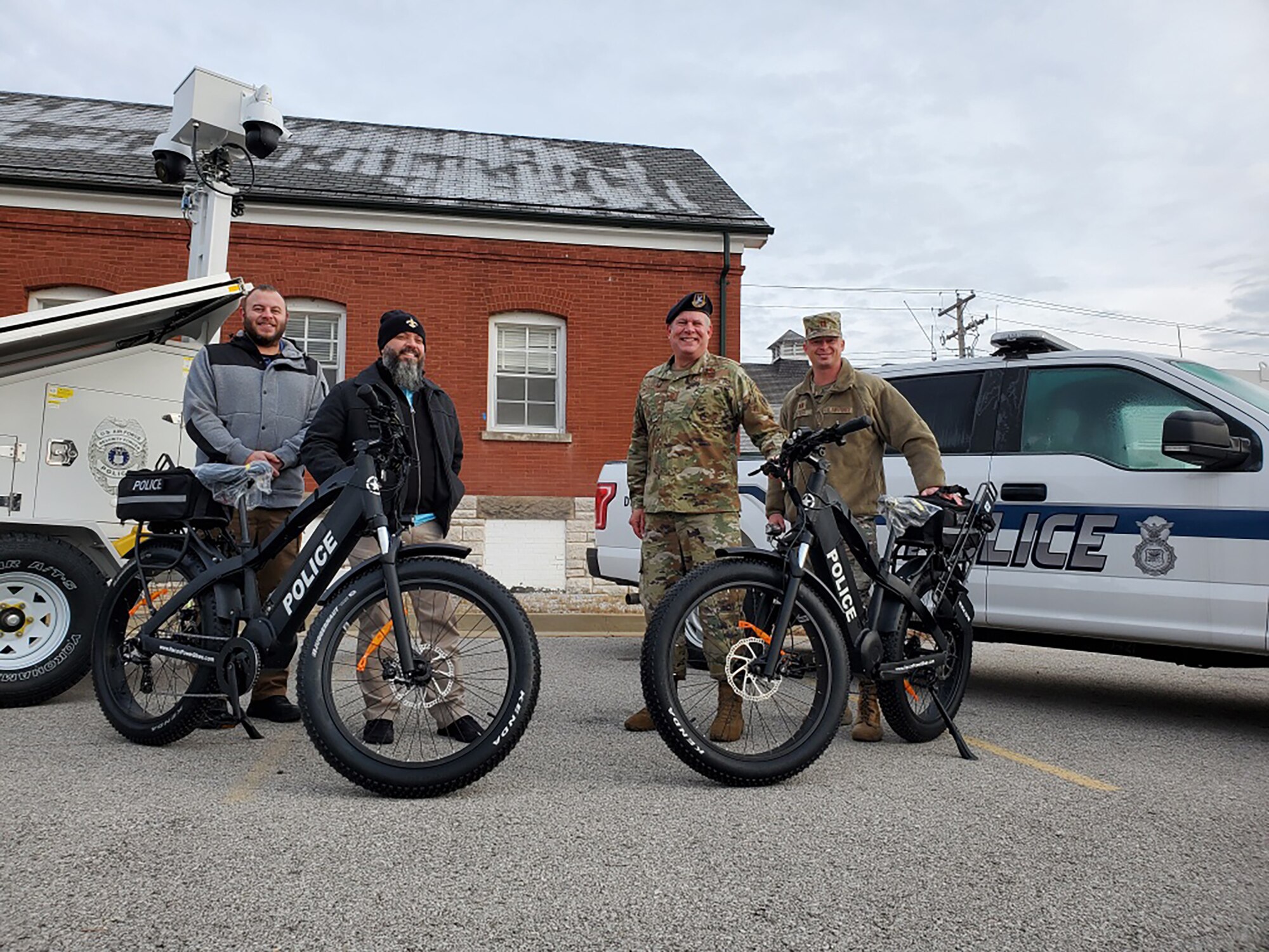 Department of the Air Force civilian police and Air National Guard members pose with electric bicycles delivered to Jefferson Barracks Air National Guard Station, St. Louis, Missouri, December 15, 2020. The newly-formed civilian police force will patrol the installation using bicycles and vehicles. (Courtesy Photo)