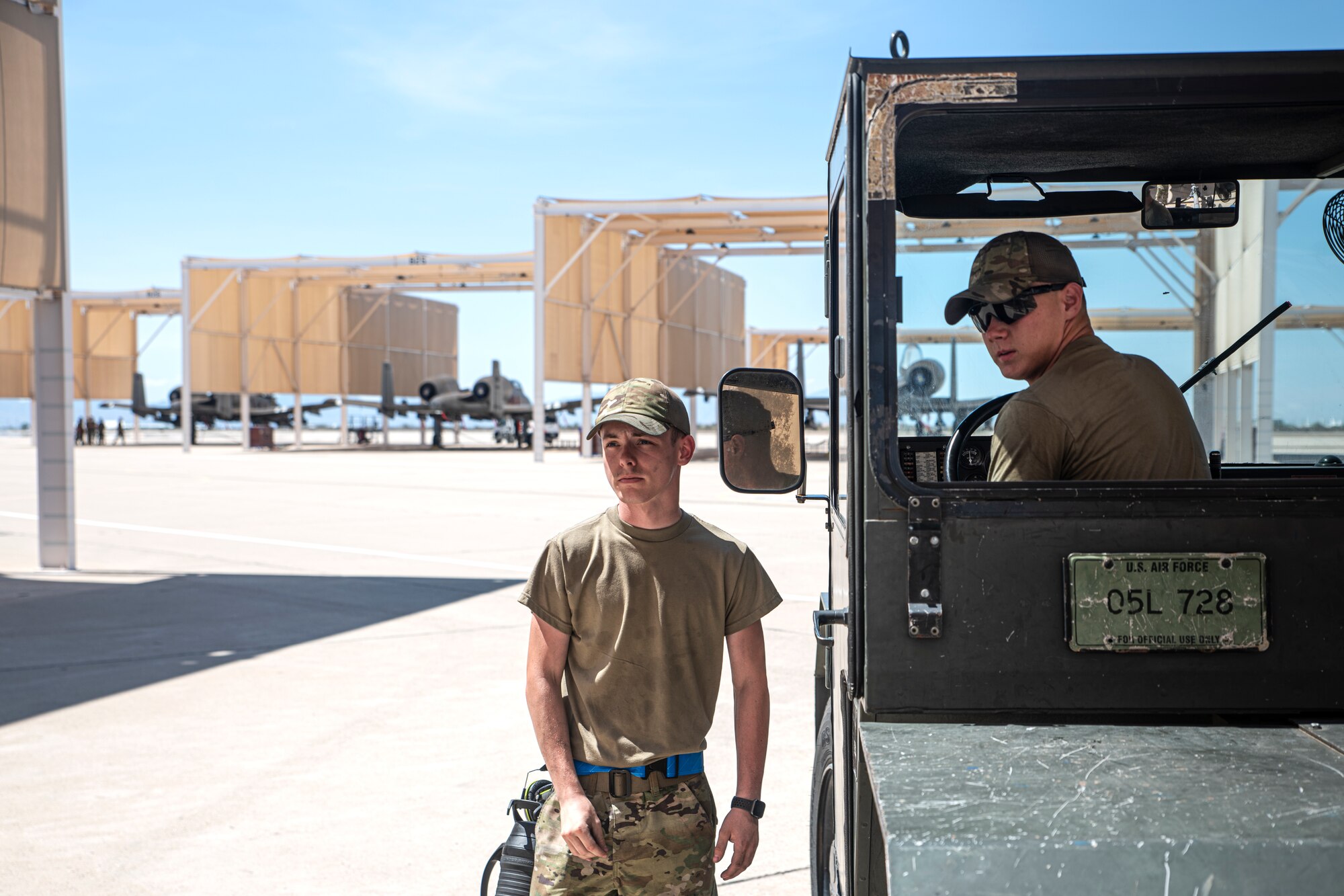 A photo of Airmen in a truck