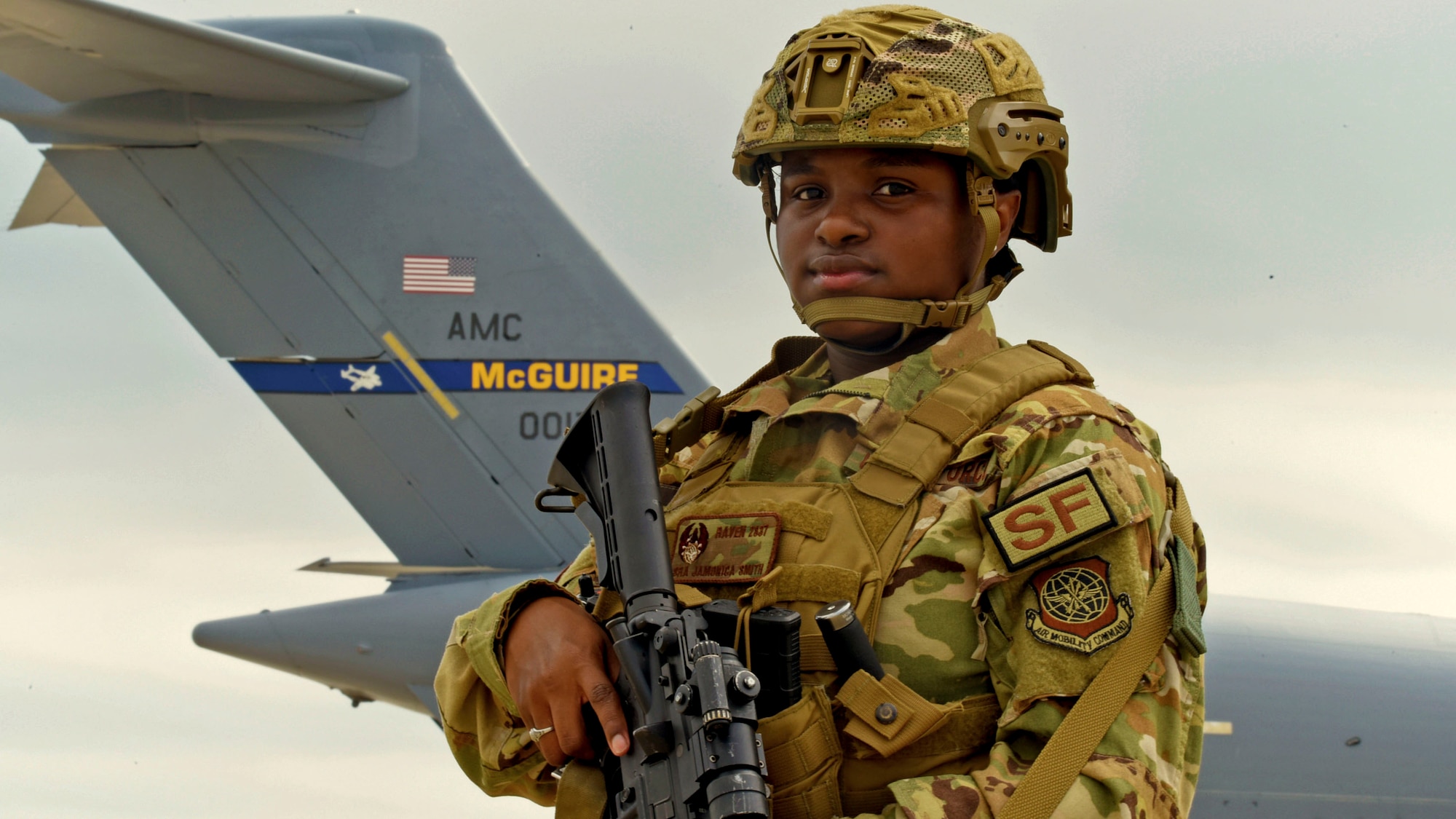 U.S. Air Force SrA Jamonica Smith, 87th Security Forces Squadron, Raven Instructor, poses next to a C-17 Globemaster III at Joint Base McGuire-Dix-Lakehurst on July 13, 2021.