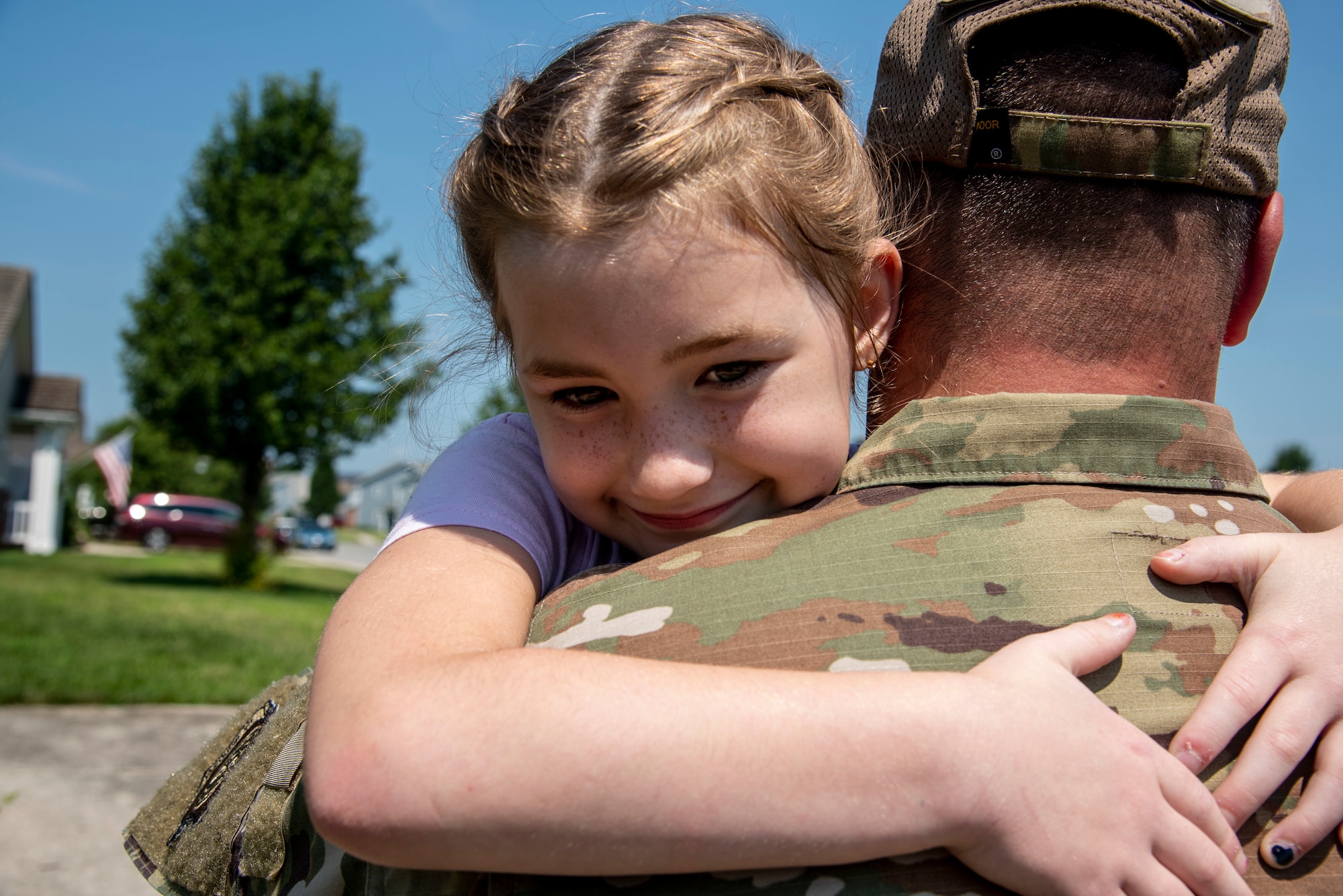 Father and daughter reunite on Dover Air Force, Delaware, July 16, 2021. The 436th Force Support Squadron child and youth services, in coordination with the Air Force Aid Society, provide military families with free child care to offset associated costs in the absence of extended family members during unique challenges they may face. (U.S. Air Force photo by Tech. Sgt. Nicole Leidholm)
