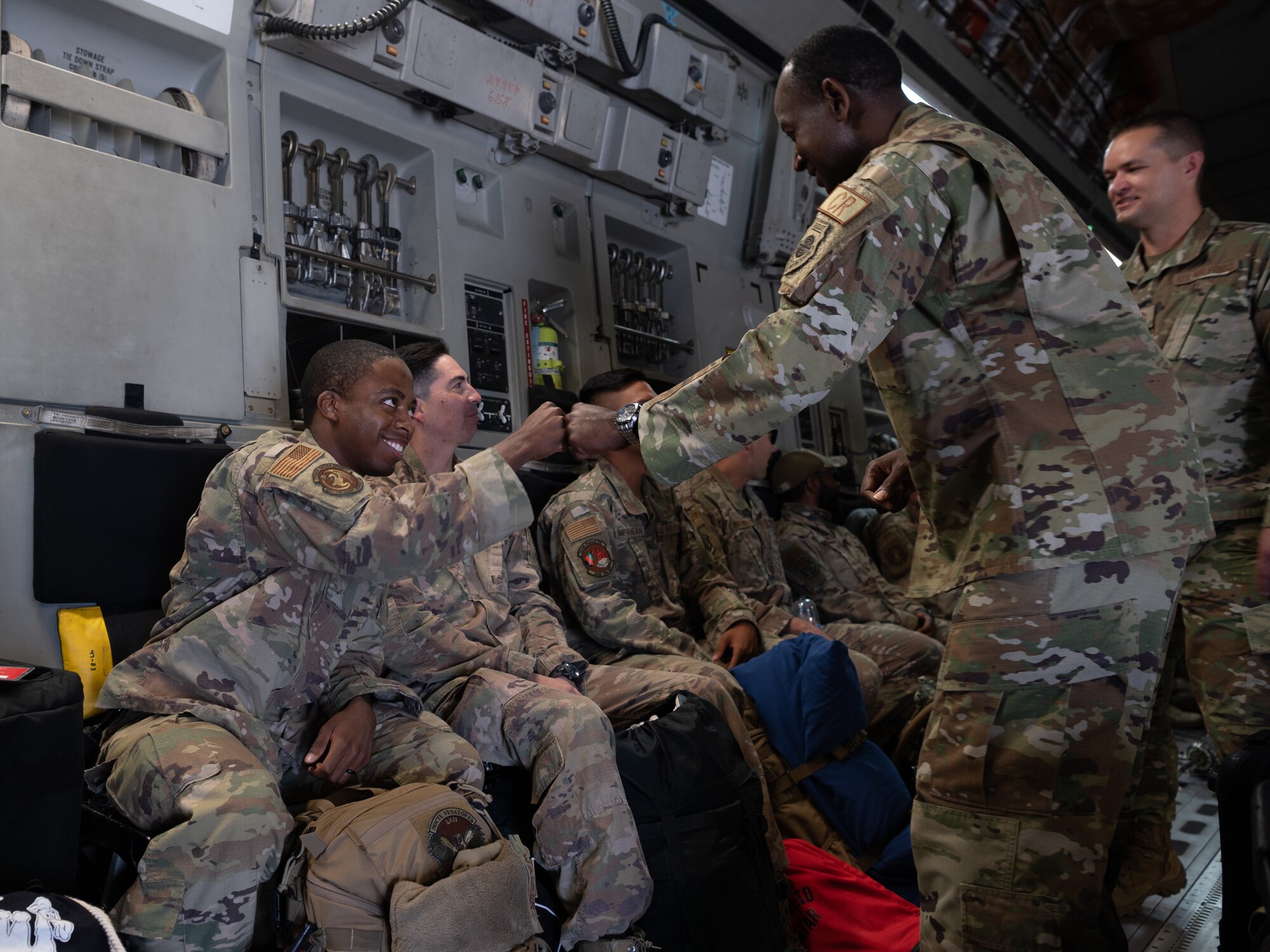 Col. Travis L. Edwards, 621st Contingency Response Wing commander, greets Airmen with the 821st Contingency Response Group upon their return from supporting retrograde operations in the CENTRAL COMMAND AREA OF RESPONSIBILITY June 19, 2021, at Joint Base McGuire-Dix-Lakehurst, New Jersey. The 821st CRG was part of Task Force 74 that assisted Resolute Support Mission Airmen with the safe and orderly withdrawal. (U.S. Air Force photo by Staff Sgt. Sarah Brice)