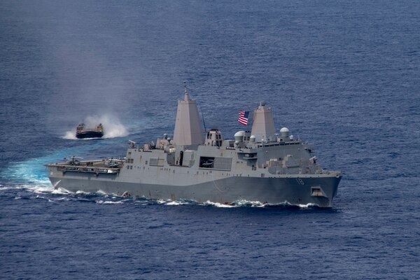 PHILIPPINE SEA (June 13, 2021) Amphibious transport dock USS New Orleans (LPD 19), right, sails alongside a Japan Maritime Self Defense Force landing craft, air cushion. The America Amphibious Ready Group, along with the 31st Marine Expeditionary Unit, is operating in the U.S. 7th Fleet area of operations to enhance interoperability with allies and partners and serve as a ready response force to defend peace and stability in the Indo-Pacific region.