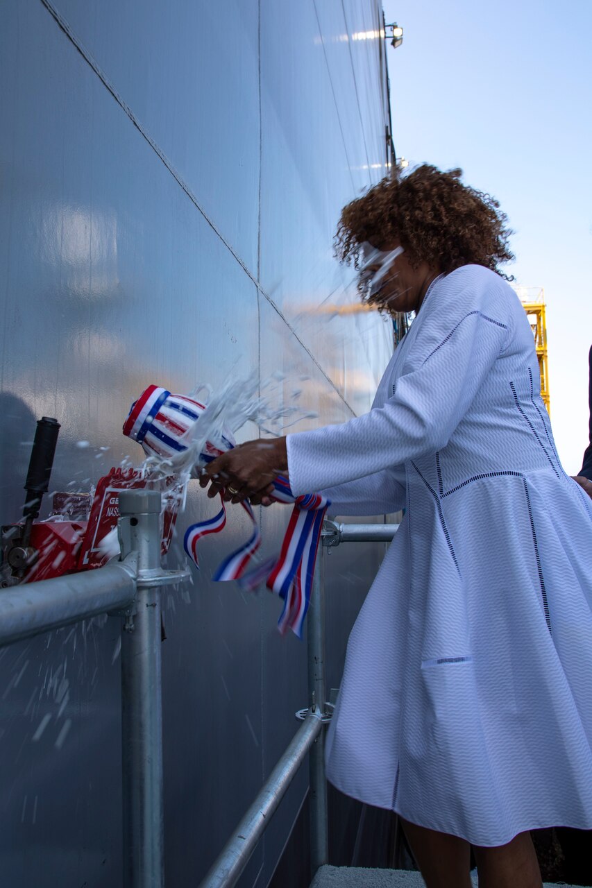 Ship’s sponsor Alfre Woodard Spencer christens the future USNS John Lewis (T-AO 205) during a christening ceremony in San Diego for the Navy’s first John Lewis-class replenishment oiler.