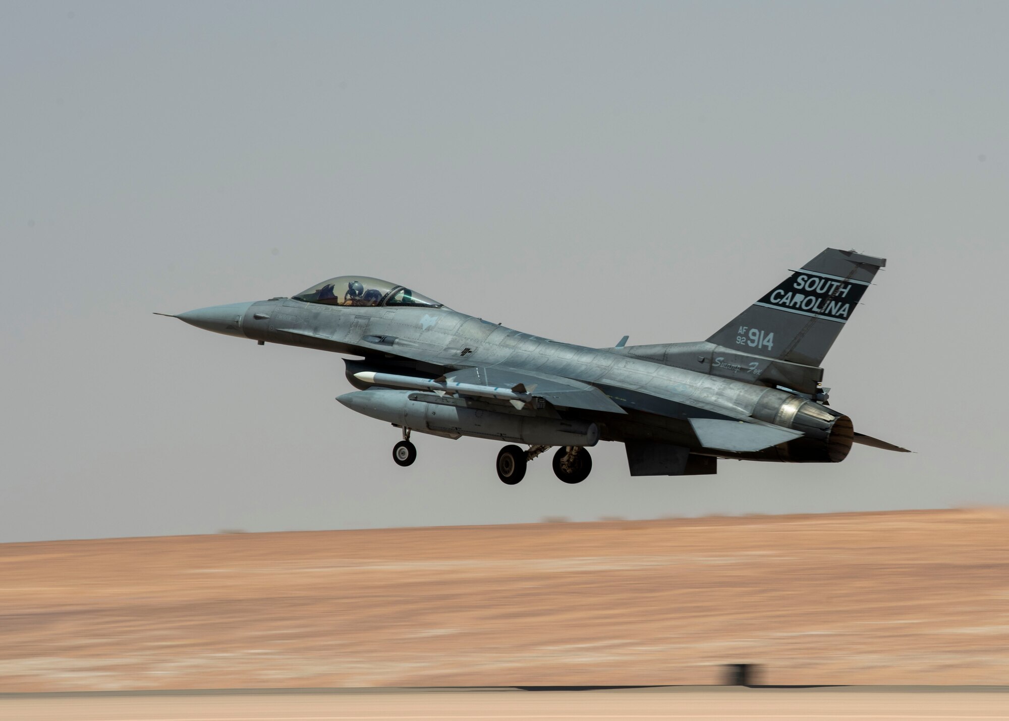 A U.S. Air Force F-16 Fighting Falcon takes off from a flightline at Prince Sultan Air Base, Kingdom of Saudi Arabia, to take part in a counter unmanned aerial system integration mission with joint and Royal Saudi aircraft, June 30, 2021. U.S. Air Forces Central aircraft regularly work with coalition and partner nations to test their collective counter-UAS capabilities to ensure the security and stability of regional airspace. (U.S. Air Force photo by Technical Sgt. Veronica Woodward)