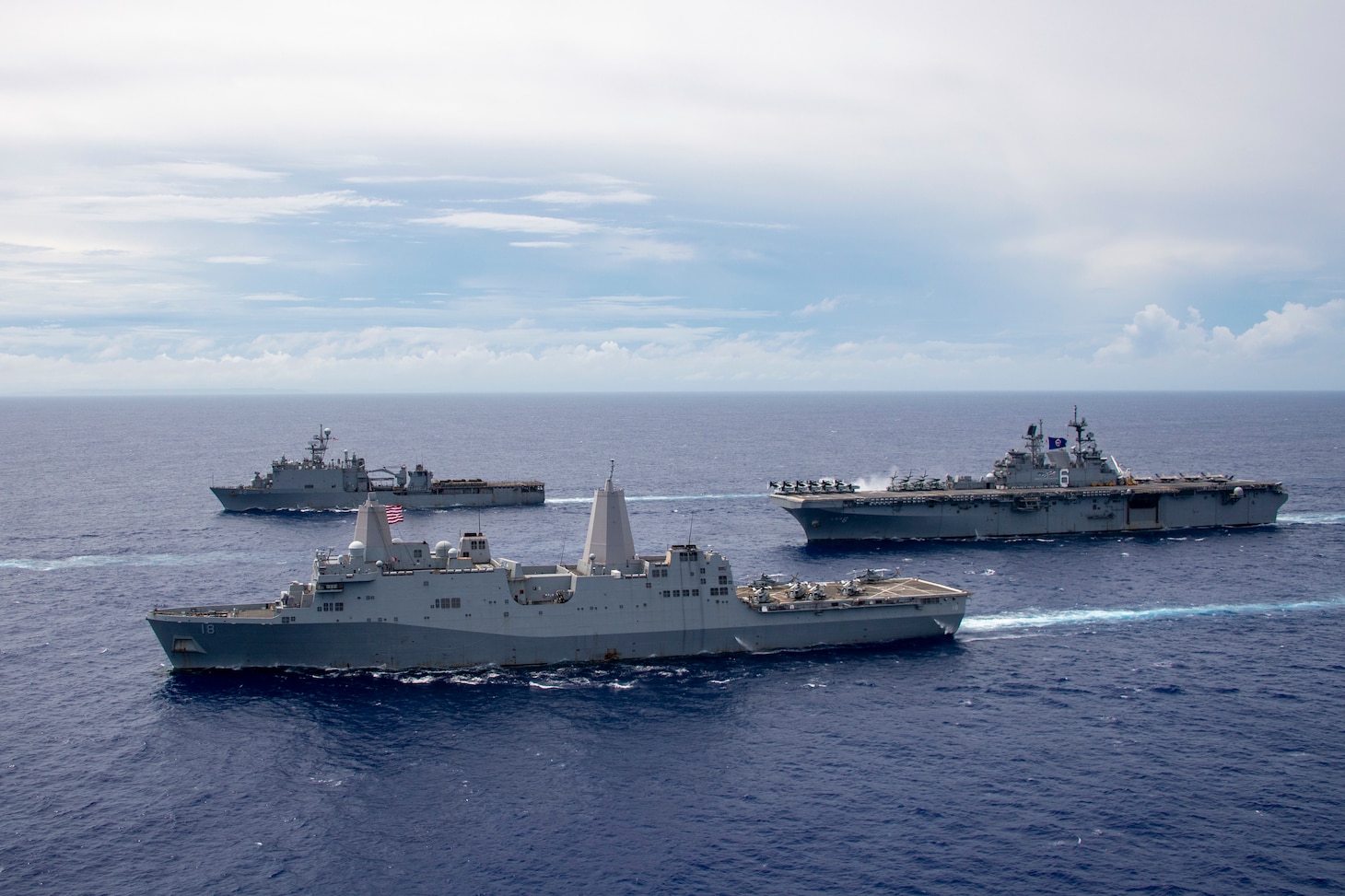 PHILIPPINE SEA (June 13, 2021) The America Amphibious Ready Group (ARG) sail in formation. Clockwise from right: USS America (LHA 6), USS New Orleans (LPD 18), USS Germantown (LSD 42). The America ARG, along with the 31st Marine Expeditionary Unit, is operating in the U.S. 7th Fleet area of operations to enhance interoperability with allies and partners and serve as a ready response force to defend peace and stability in the Indo-Pacific region.