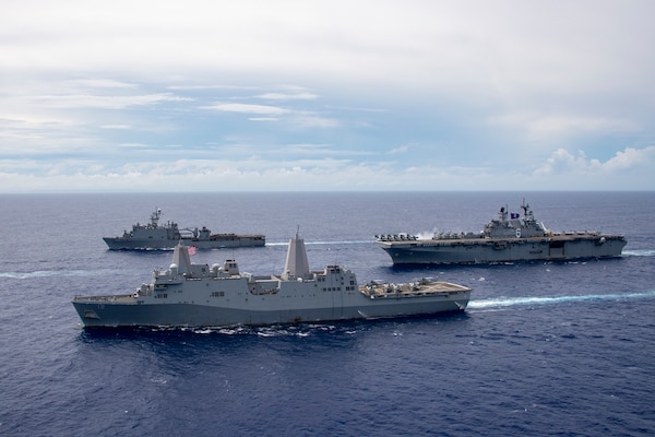 PHILIPPINE SEA (June 13, 2021) The America Amphibious Ready Group (ARG) sail in formation. Clockwise from right: USS America (LHA 6), USS New Orleans (LPD 18), USS Germantown (LSD 42). The America ARG, along with the 31st Marine Expeditionary Unit, is operating in the U.S. 7th Fleet area of operations to enhance interoperability with allies and partners and serve as a ready response force to defend peace and stability in the Indo-Pacific region.