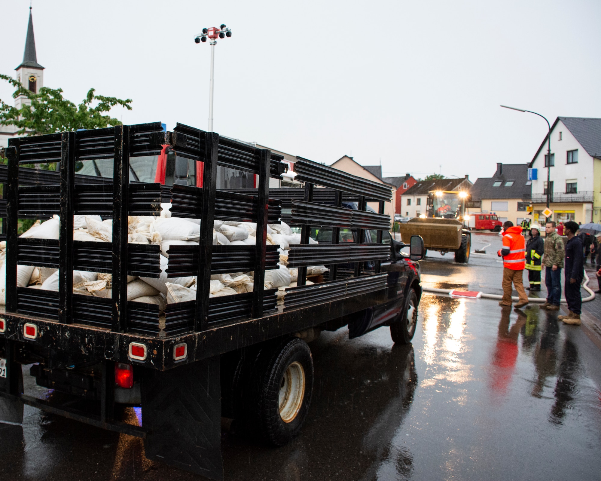 Members from the 52nd Civil Engineer Squadron from Spangdahlem Air Base, Germany, arrive in Binsfeld, Germany, to deliver sandbags after flood waters threatened homes and businesses in the town July 14, 2021.