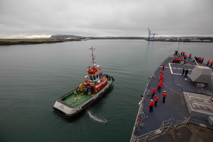 (July 18, 2021) Sailors aboard the Arleigh Burke-class guided-missile destroyer USS Roosevelt (DDG 80) handle line from a tugboat, July 18, 2021. Roosevelt, forward-deployed to Rota, Spain, is on its second patrol in the U.S. Sixth Fleet area of operations in support of regional allies and partners and U.S. national security interests in Europe and Africa.