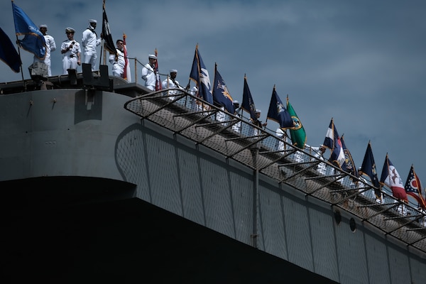 Sailors man the rails as the Nimitz-class aircraft carrier USS Dwight D. Eisenhower (CVN 69) returns to Naval Station Norfolk, July 18.