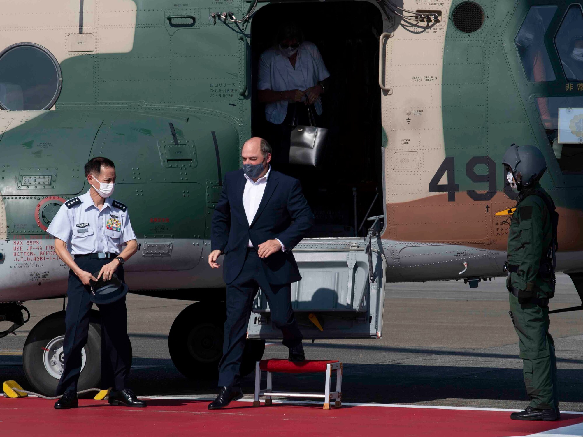 U.K. Secretary of State for Defence Ben Wallace, center, exits a Boeing/Kawasaki CH-47JA Chinook at Yokota Air Base, Japan, July 19, 2021.