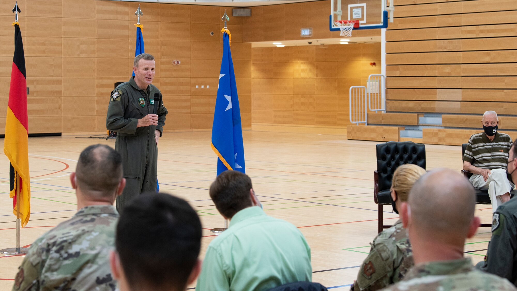 U.S. Air Force Gen. Tod Wolters, commander of U.S. European Command and NATO Supreme Allied Commander-Europe, speaks to the accomplishments of George Price, 52nd Force Support Squadron special events coordinator, during an Outstanding Civilian Service Award recognition ceremony for George Price, 52nd Force Support Squadron special events coordinator, July 14, 2021, on Spangdahlem Air Base, Germany. The event, held at the George Price Gymnasium, recognized Price’s four decades of dedication and hard work as a DoD civilian. (U.S. Air Force photo by Tech. Sgt. Anthony Plyler)