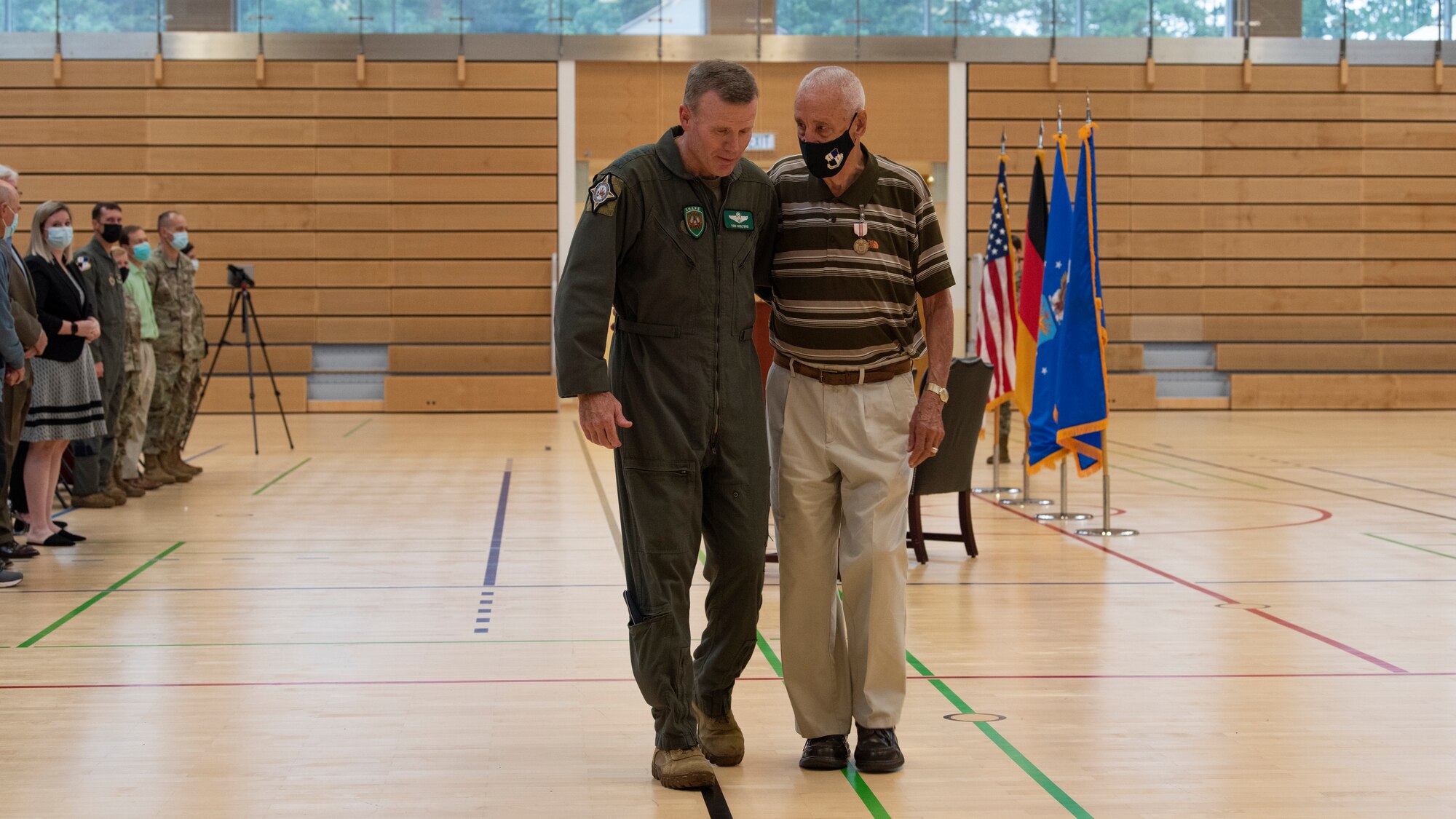 U.S. Air Force Gen. Tod Wolters, commander of U.S. European Command and NATO Supreme Allied Commander-Europe (left), and George Price, 52nd Force Support Squadron special events coordinator, depart the Outstanding Civilian Service Award recognition ceremony, July 14, 2021, on Spangdahlem Air Base, Germany. Price served in the U.S. Air Force for 26 years and has worked for the U.S. Air Force in Germany as a civilian since 1977. (U.S. Air Force photo by Tech. Sgt. Anthony Plyler)